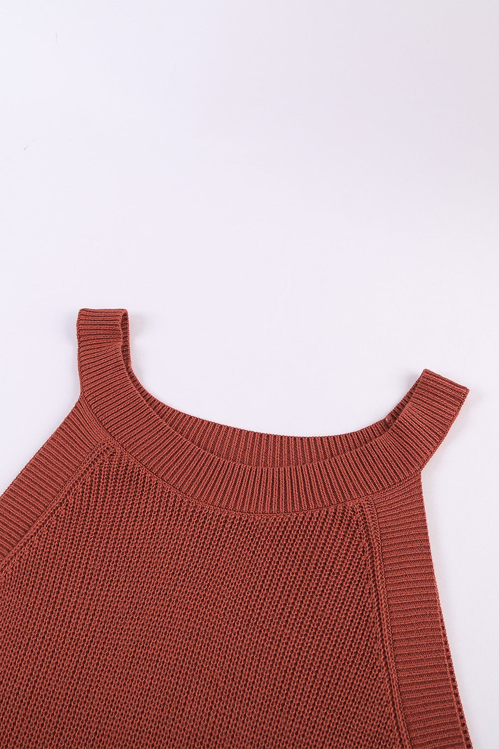 Fiery red solid ribbed knit slim-fit tank top displayed on a mannequin, showcasing its stylish design and texture.