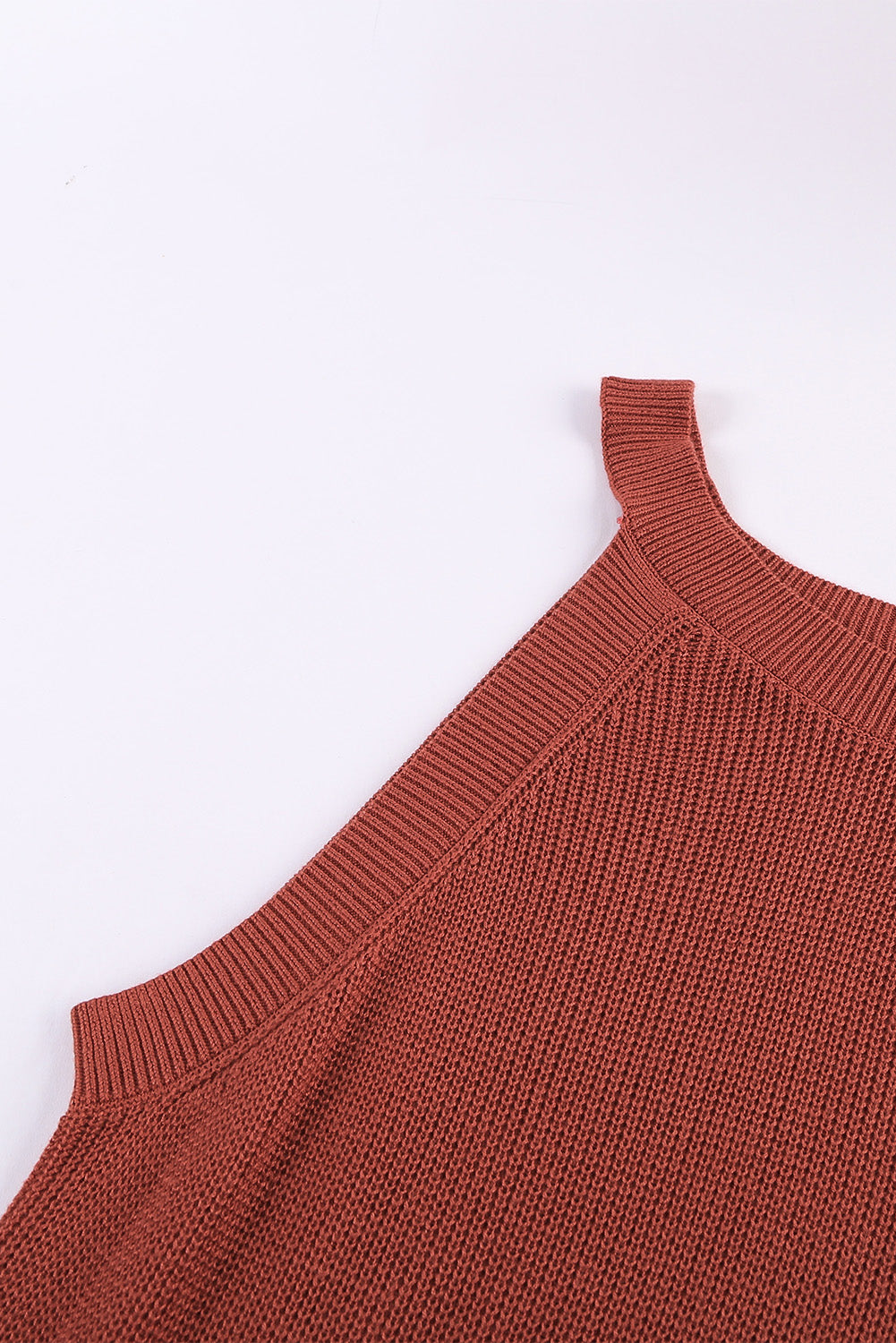 Fiery red solid ribbed knit slim-fit tank top displayed on a mannequin, showcasing its stylish design and texture.