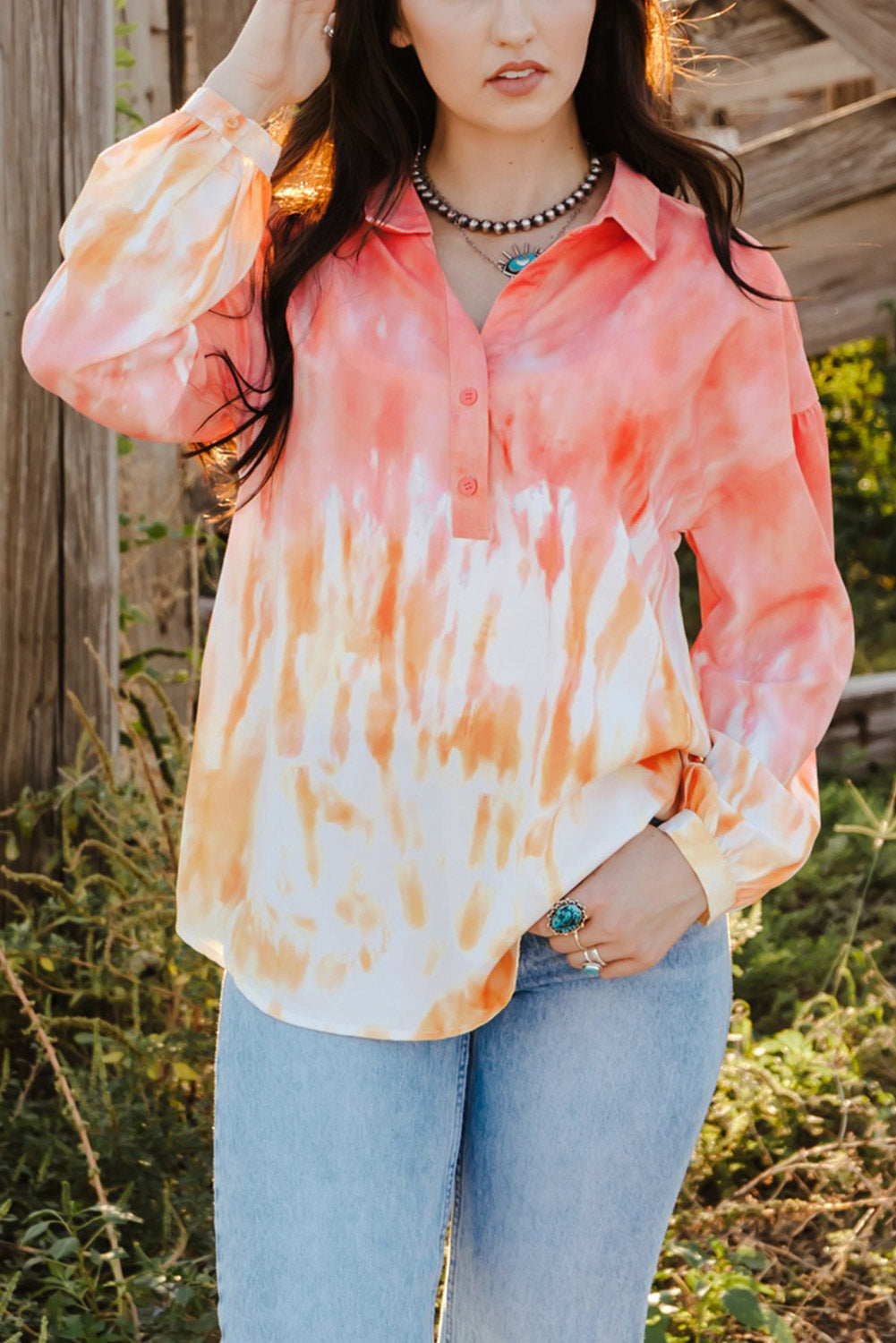 Fiery Red Tie Dye Print Lace-up Buttoned Henley Top displayed on a mannequin, showcasing its vibrant colors and unique back design.