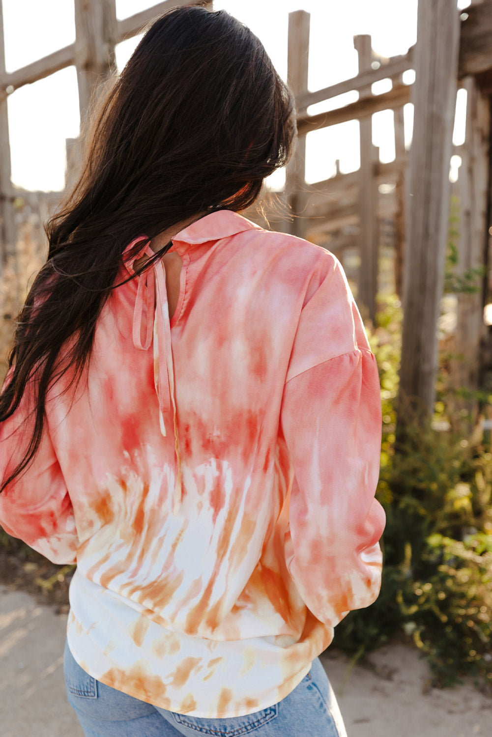 Fiery Red Tie Dye Print Lace-up Buttoned Henley Top displayed on a mannequin, showcasing its vibrant colors and unique back design.