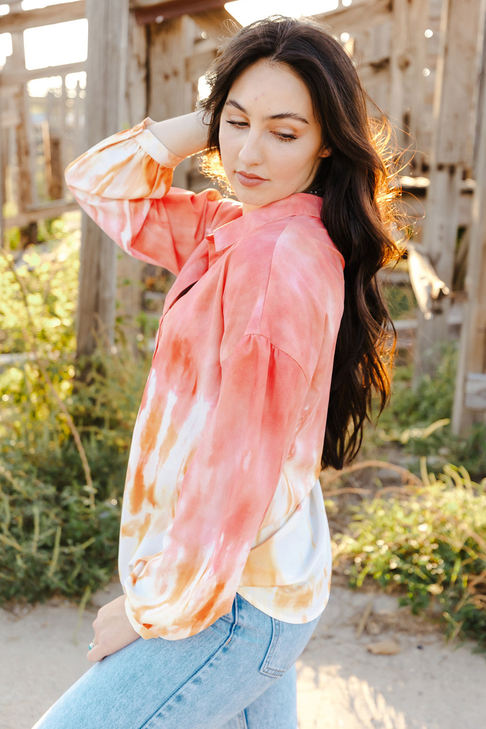 Fiery Red Tie Dye Print Lace-up Buttoned Henley Top displayed on a mannequin, showcasing its vibrant colors and unique back design.