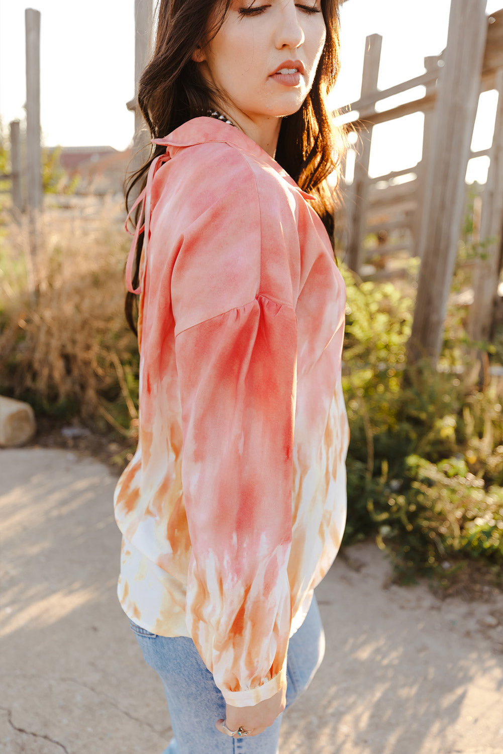 Fiery Red Tie Dye Print Lace-up Buttoned Henley Top displayed on a mannequin, showcasing its vibrant colors and unique back design.