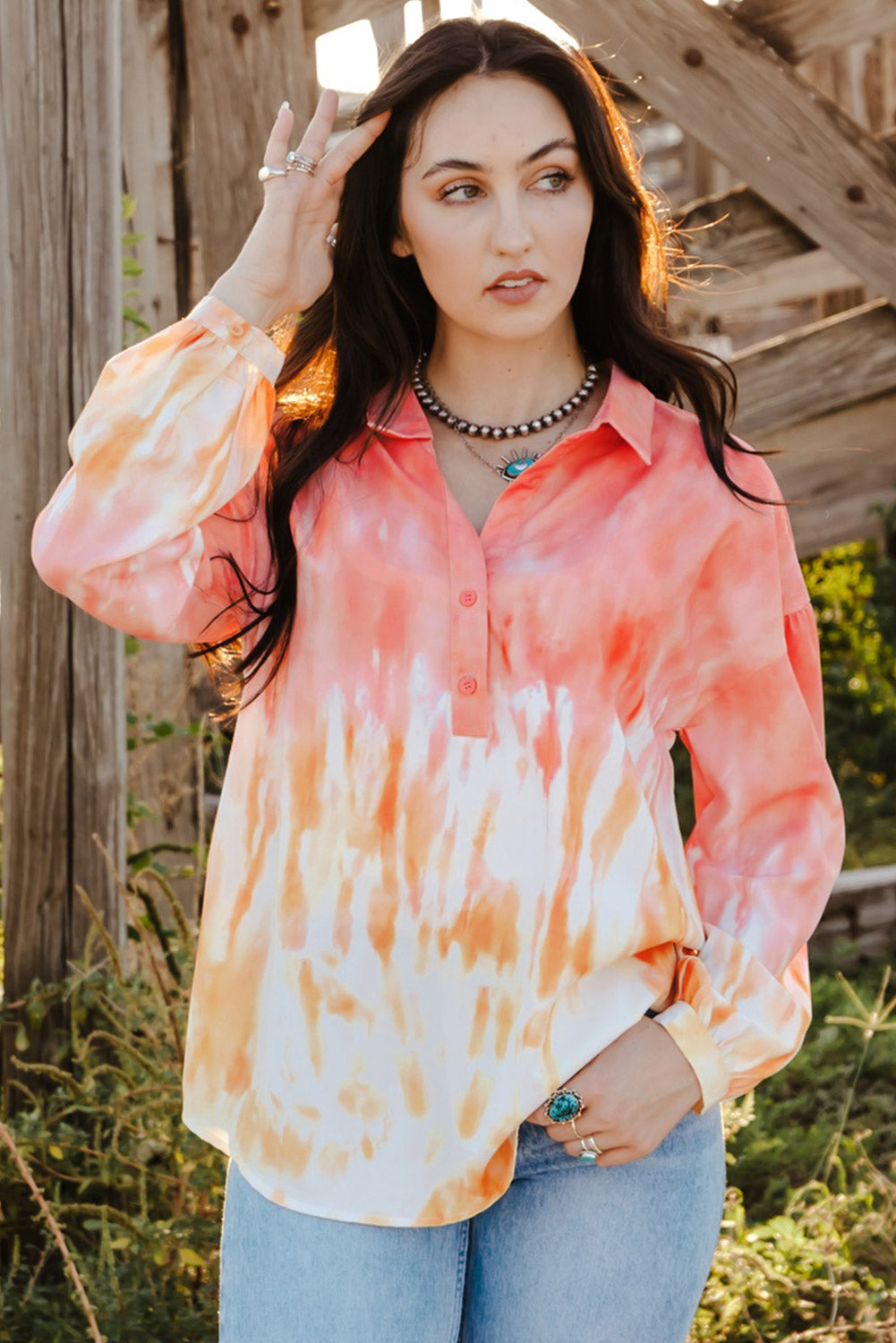 Fiery Red Tie Dye Print Lace-up Buttoned Henley Top displayed on a mannequin, showcasing its vibrant colors and unique back design.