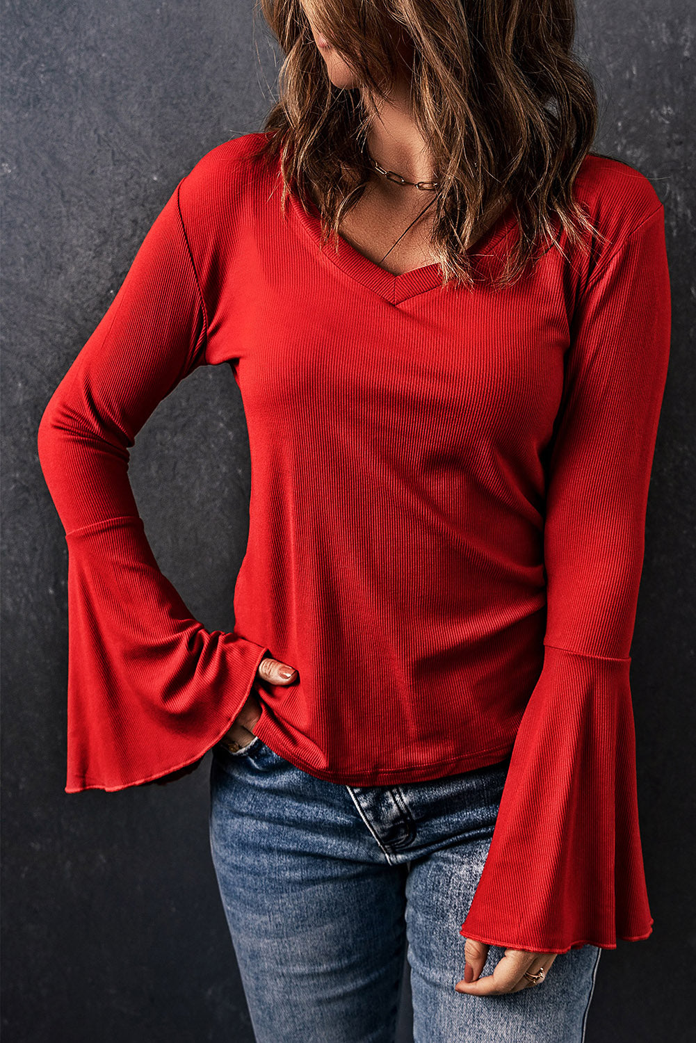 Fiery Red V Neck Knit Bell Sleeve Top with ribbed texture and stylish bell sleeves, perfect for layering or wearing alone.