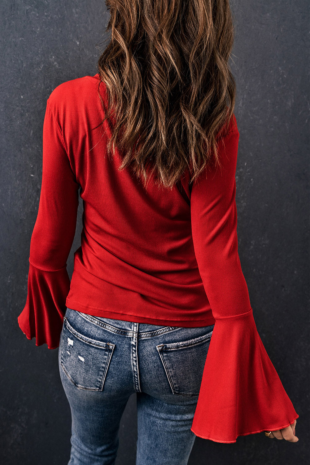 Fiery Red V Neck Knit Bell Sleeve Top with ribbed texture and stylish bell sleeves, perfect for layering or wearing alone.