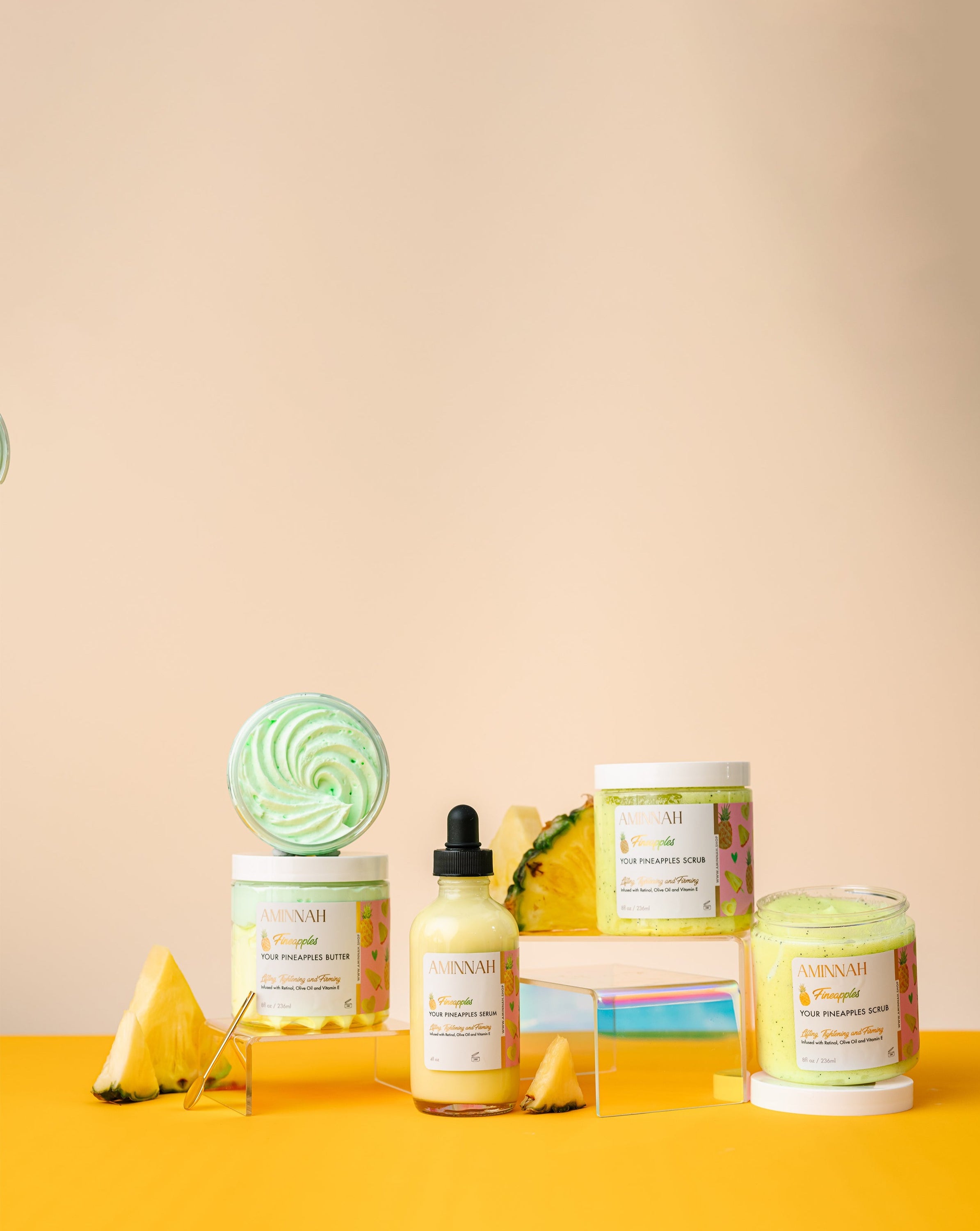 Fineapples Boob Collection featuring body butter, serum, and sugar scrub with pineapple and Vitamin E ingredients.