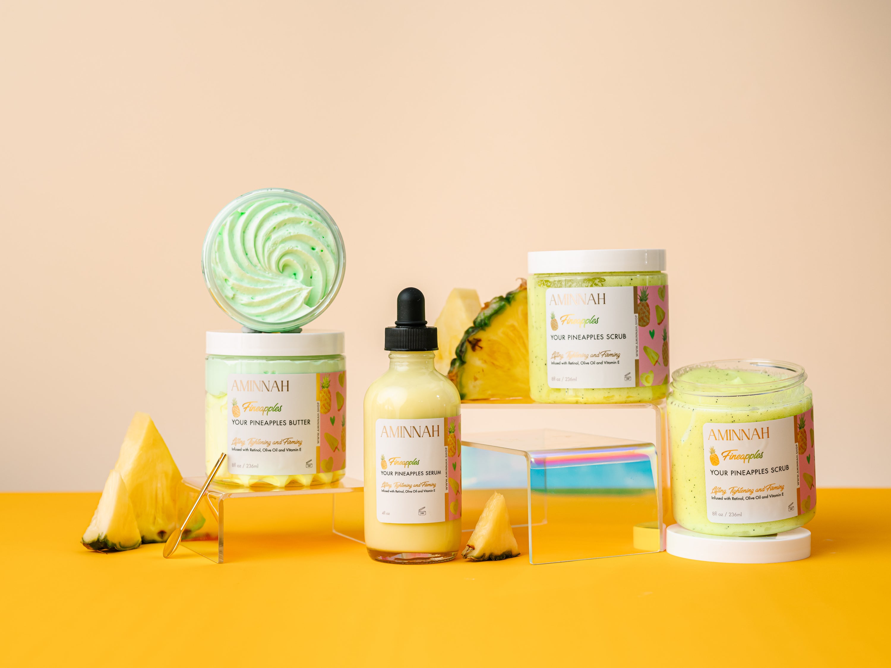 Fineapples Boob Collection featuring body butter, serum, and sugar scrub with pineapple and Vitamin E ingredients.