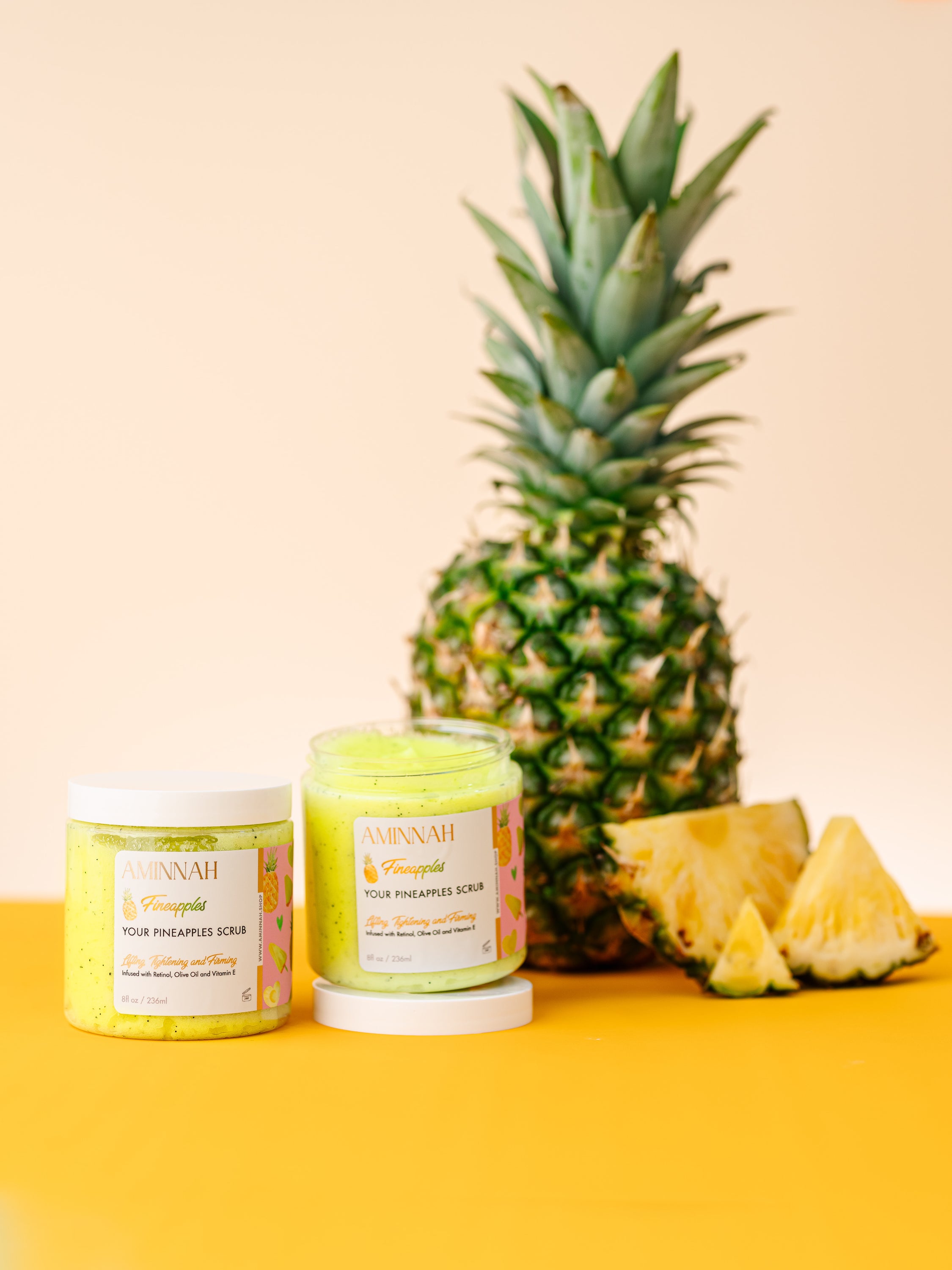 Fineapples Boob Collection featuring body butter, serum, and sugar scrub with pineapple and Vitamin E ingredients.