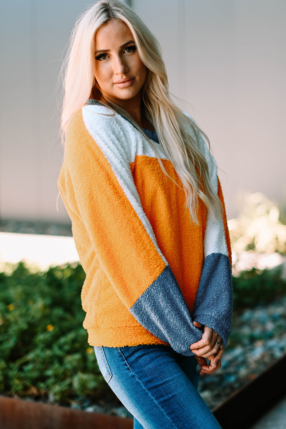 Fleece Colorblock Dolman Sleeves Pullover Top showcasing a mild heart neckline and stylish colorblock design.