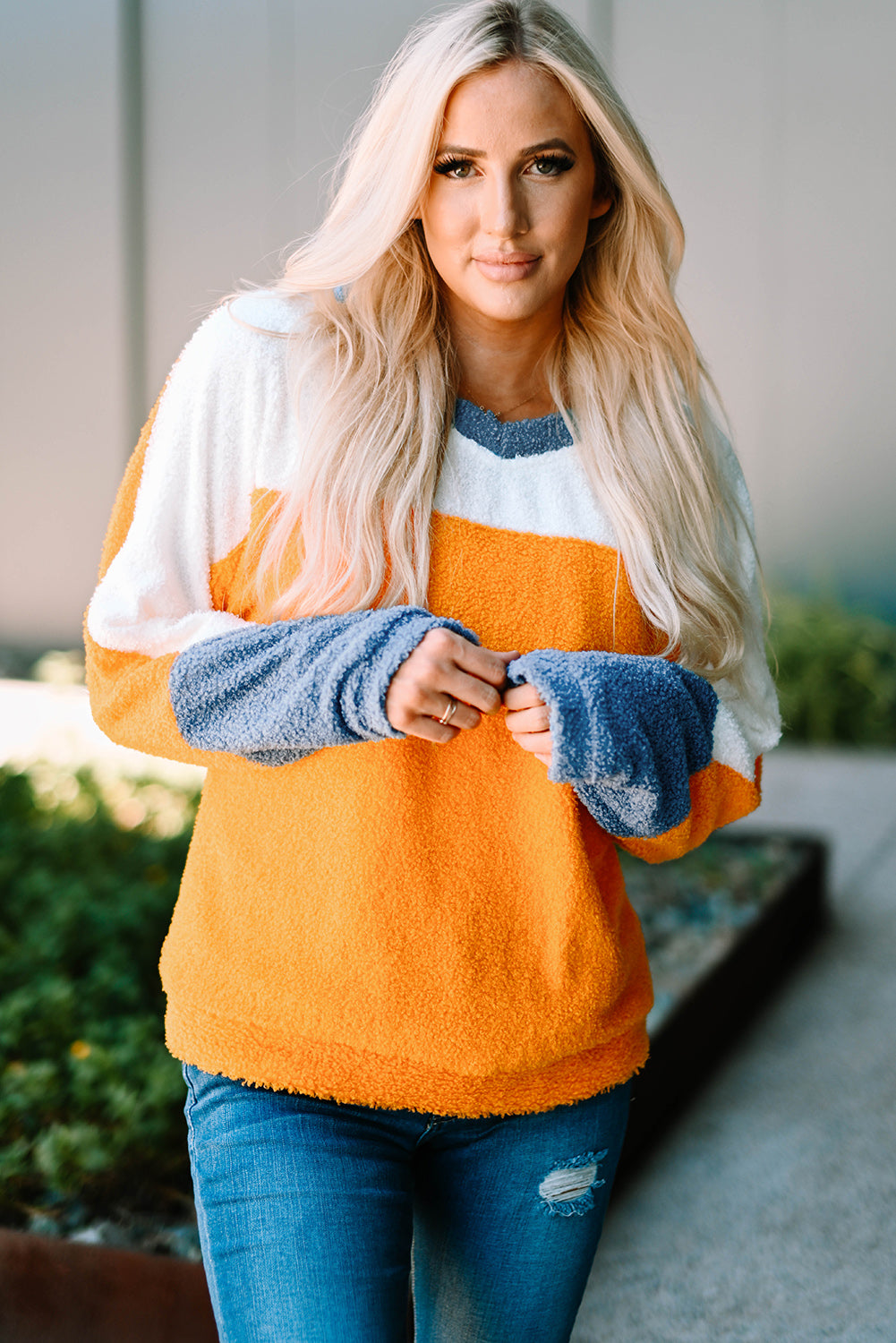 Fleece Colorblock Dolman Sleeves Pullover Top showcasing a mild heart neckline and stylish colorblock design.