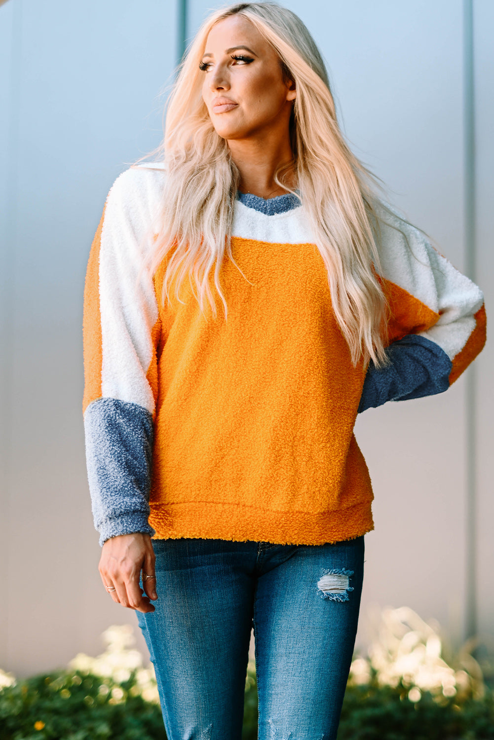 Fleece Colorblock Dolman Sleeves Pullover Top showcasing a mild heart neckline and stylish colorblock design.