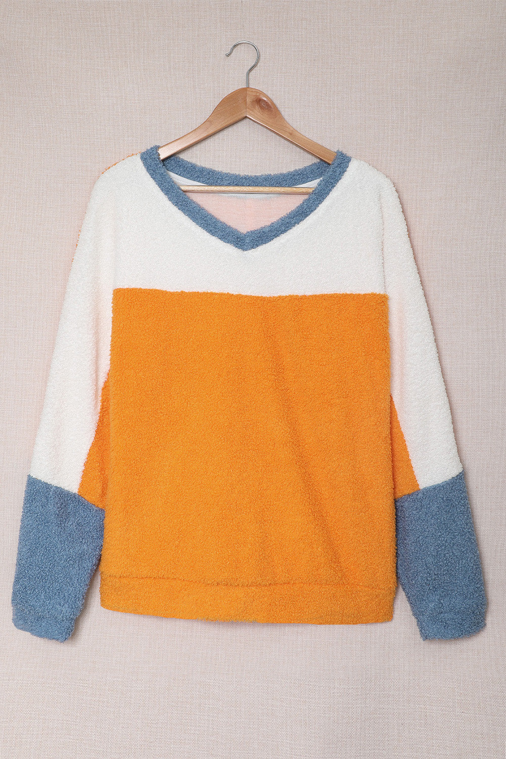 Fleece Colorblock Dolman Sleeves Pullover Top showcasing a mild heart neckline and stylish colorblock design.