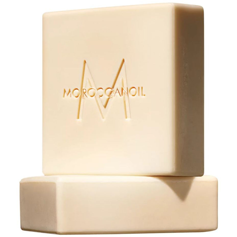 Moroccanoil Fleur D'Oranger Cleansing Bar with elegant packaging, showcasing its vibrant orange color and floral design.