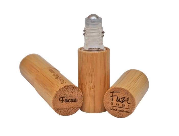 Focus - Wood Roll-On Pure Essential Oils with a woodsy scent for enhanced concentration and clarity.