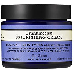 Neal's Yard Frankincense Nourishing Cream in a glass jar with a dark blue label, showcasing its luxurious texture.