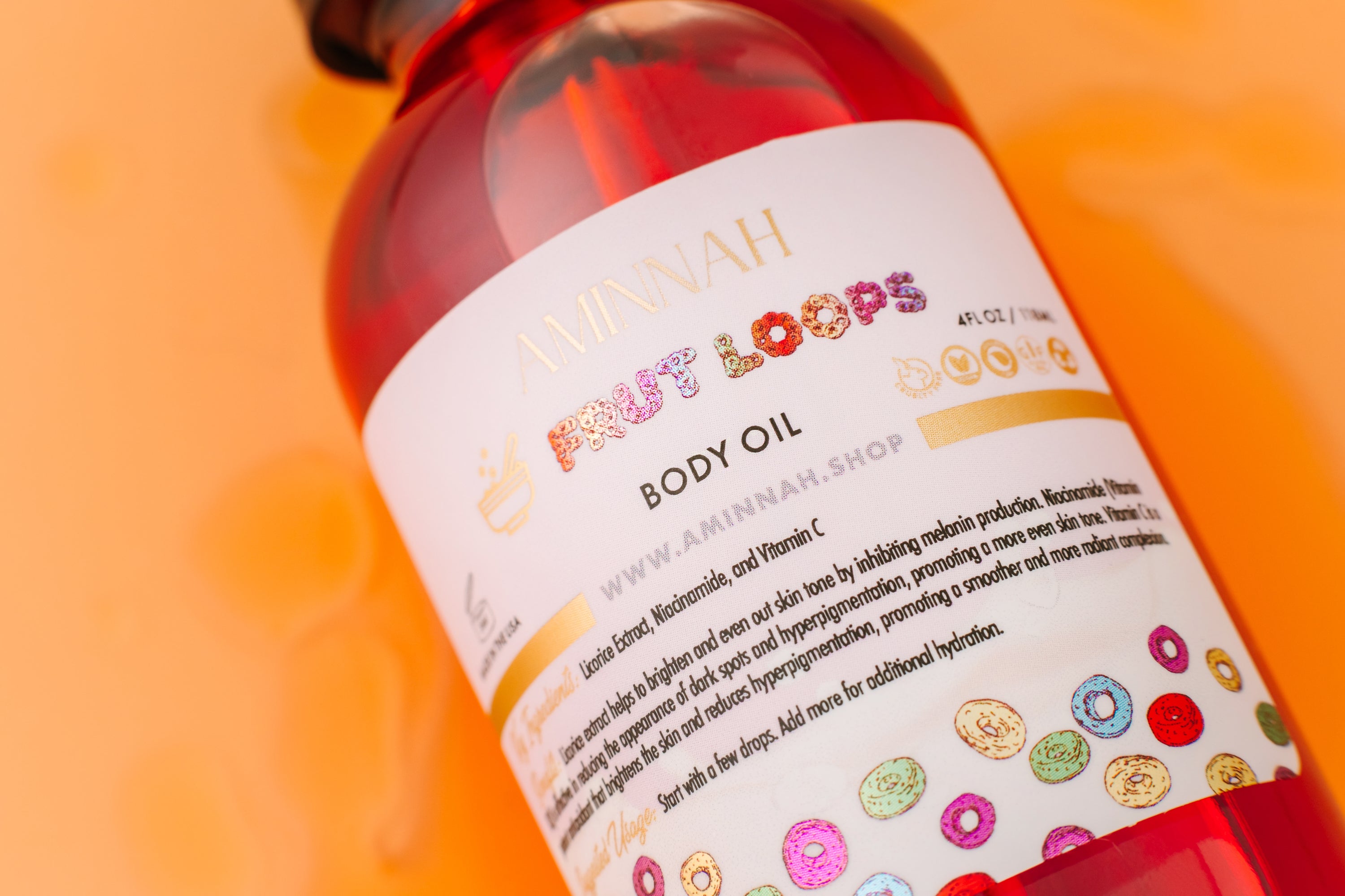 Frut Loops Body Oil bottle with colorful fruity design, showcasing its luxurious and nourishing properties.