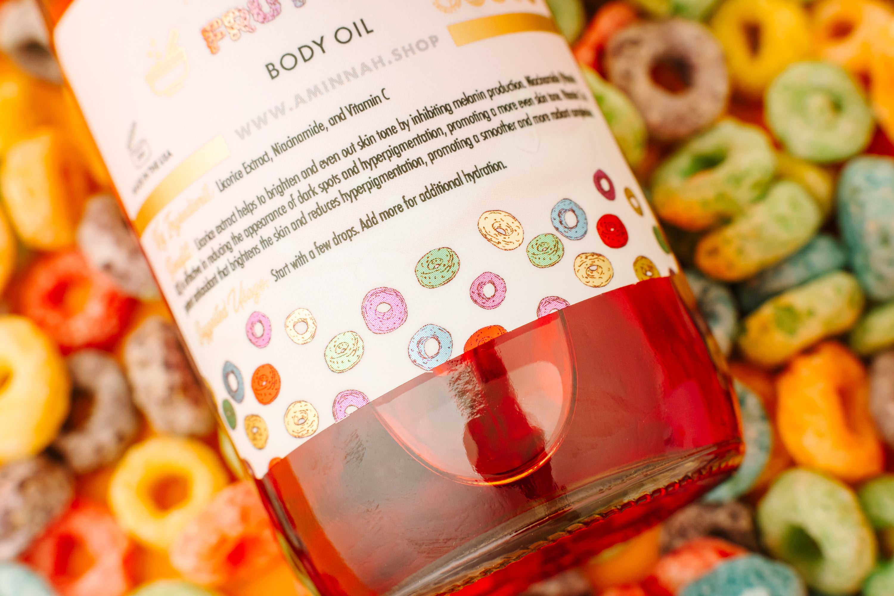 Frut Loops Body Oil bottle with colorful fruity design, showcasing its luxurious and nourishing properties.