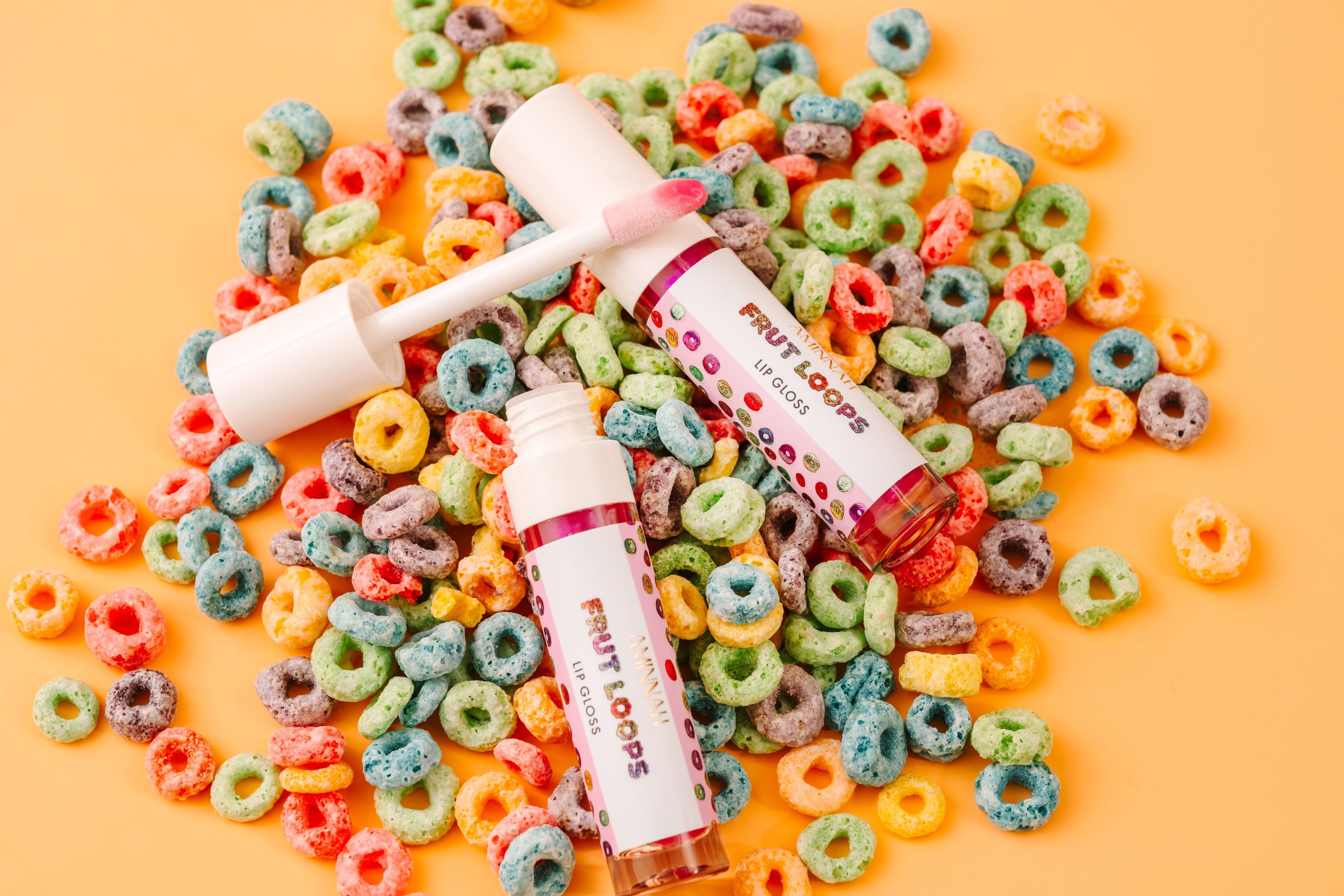 Fruit Loops Bundle featuring body butter, sugar scrub, body oil, cleansing foam, lip gloss, and bar soap with colorful packaging.