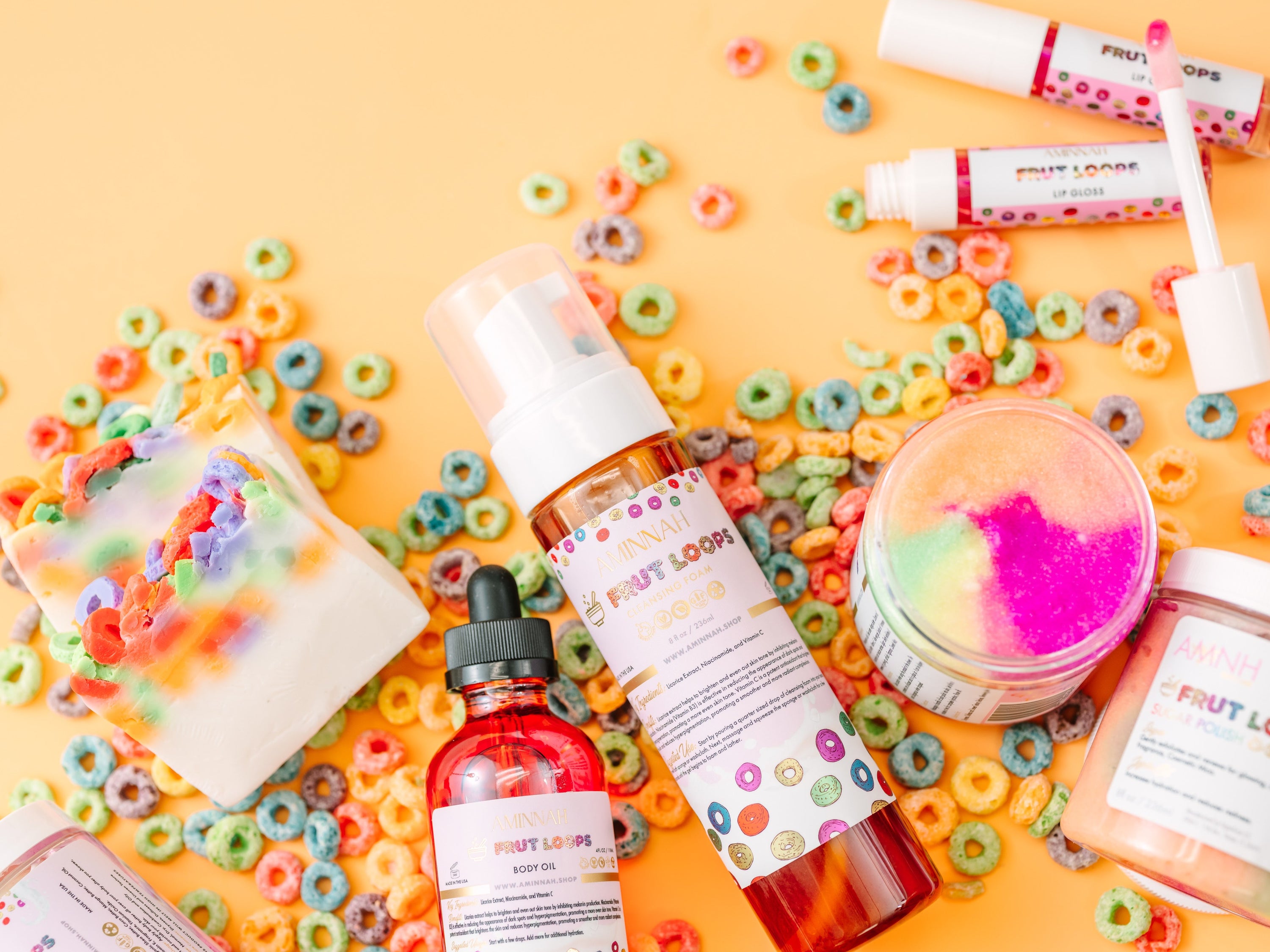 Fruit Loops Bundle featuring body butter, sugar scrub, body oil, cleansing foam, lip gloss, and bar soap with colorful packaging.