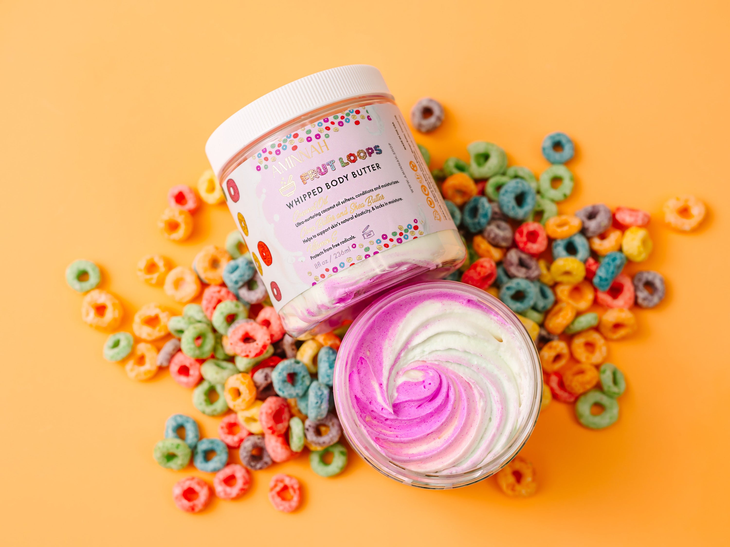 Fruit Loops Bundle featuring body butter, sugar scrub, body oil, cleansing foam, lip gloss, and bar soap with colorful packaging.