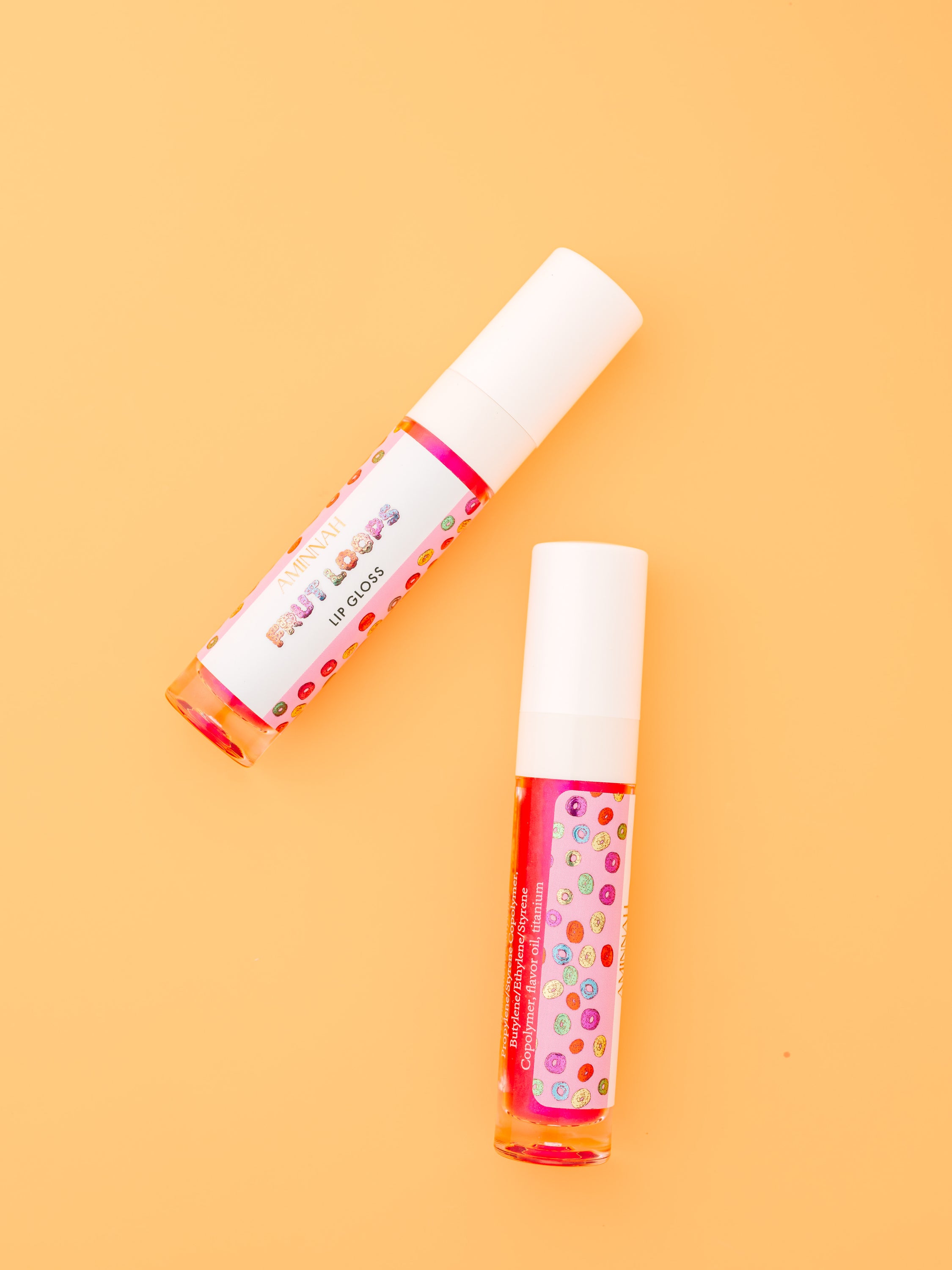 Frut Loops Lip Gloss in colorful packaging, showcasing its fruity flavor and high-shine finish.