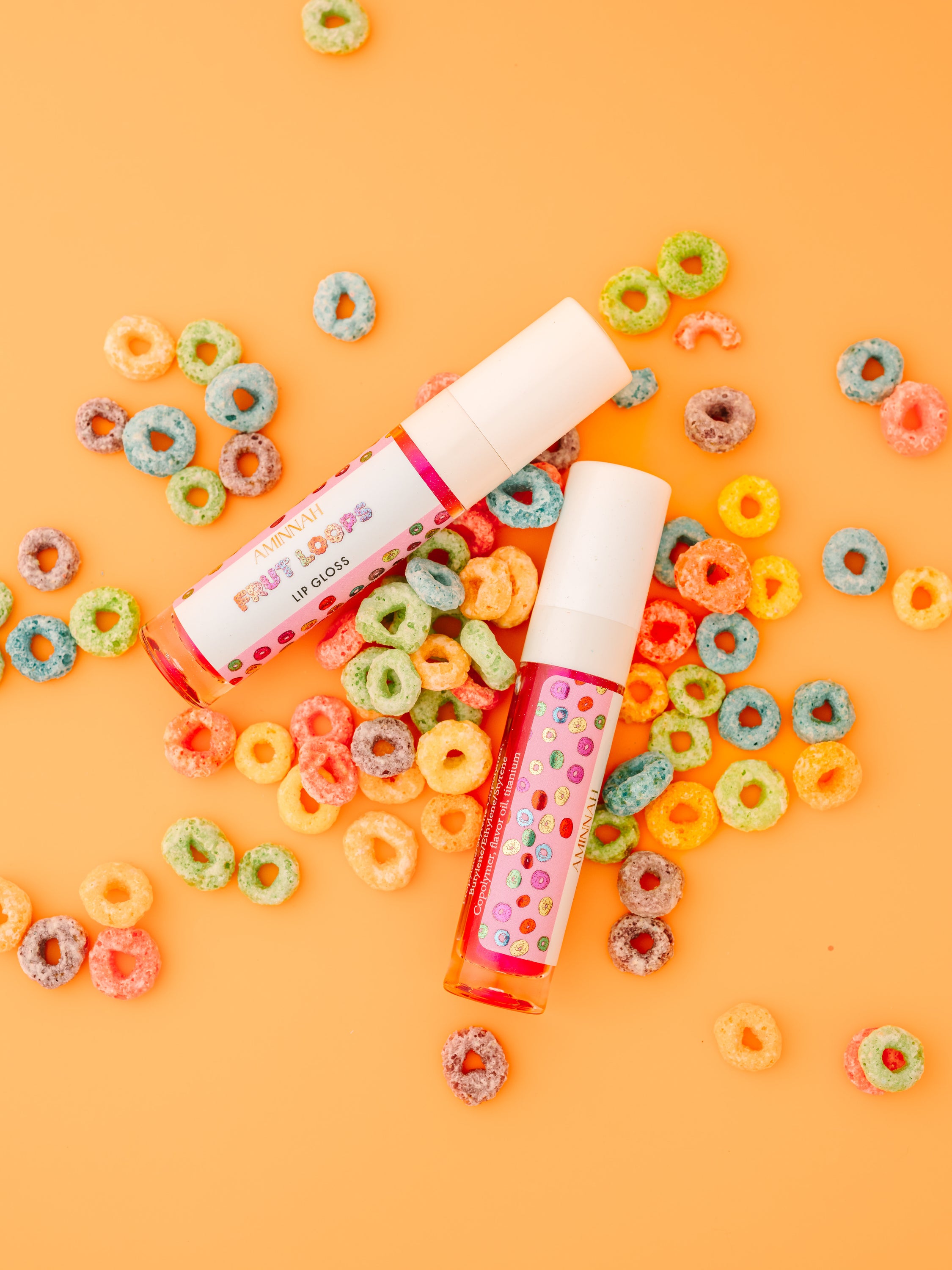 Frut Loops Lip Gloss in colorful packaging, showcasing its fruity flavor and high-shine finish.