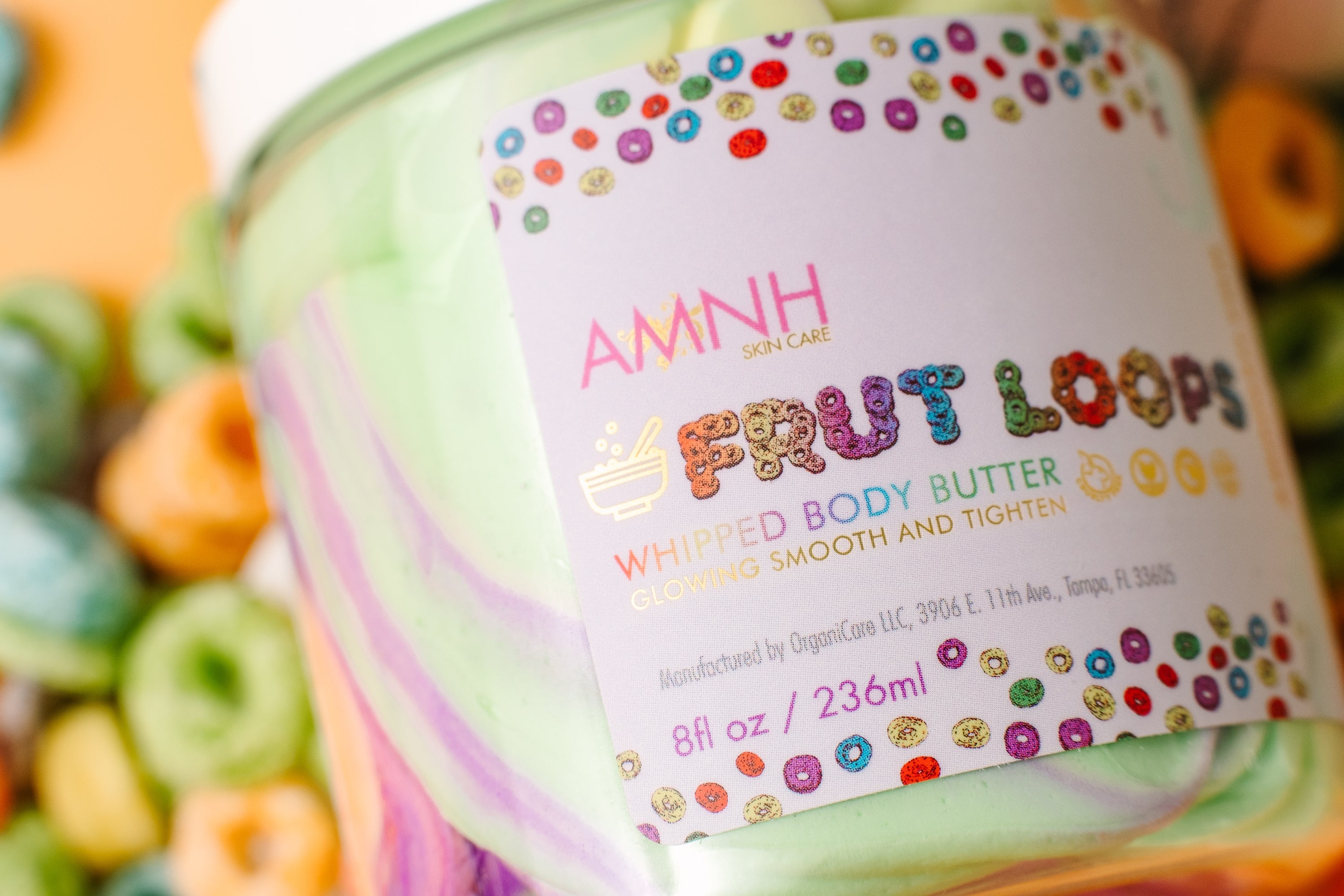 Frut Loops Whipped Body Butter in a jar, showcasing its creamy texture and vibrant colors reminiscent of Fruit Loops cereal.