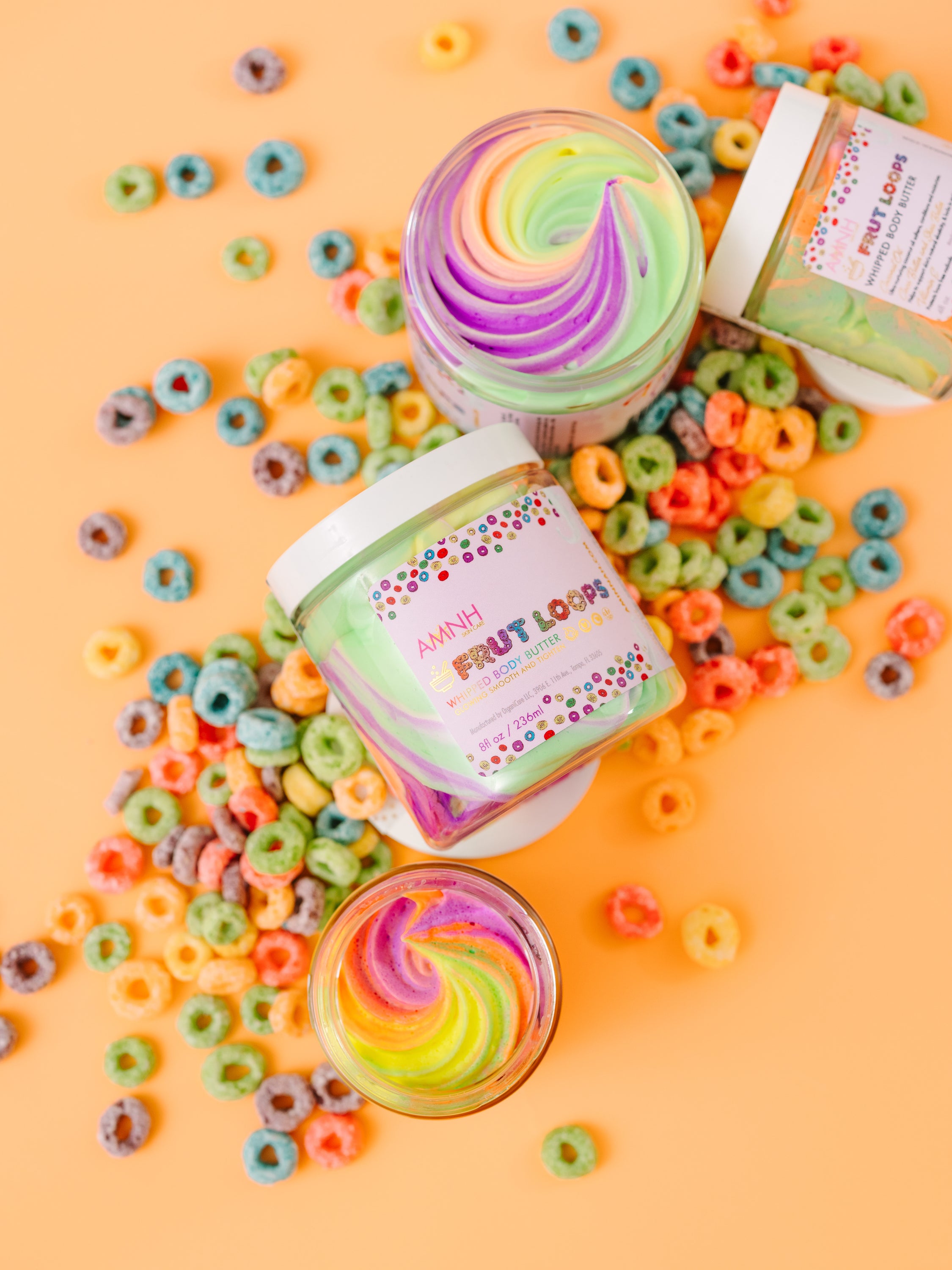 Frut Loops Whipped Body Butter in a jar, showcasing its creamy texture and vibrant colors reminiscent of Fruit Loops cereal.