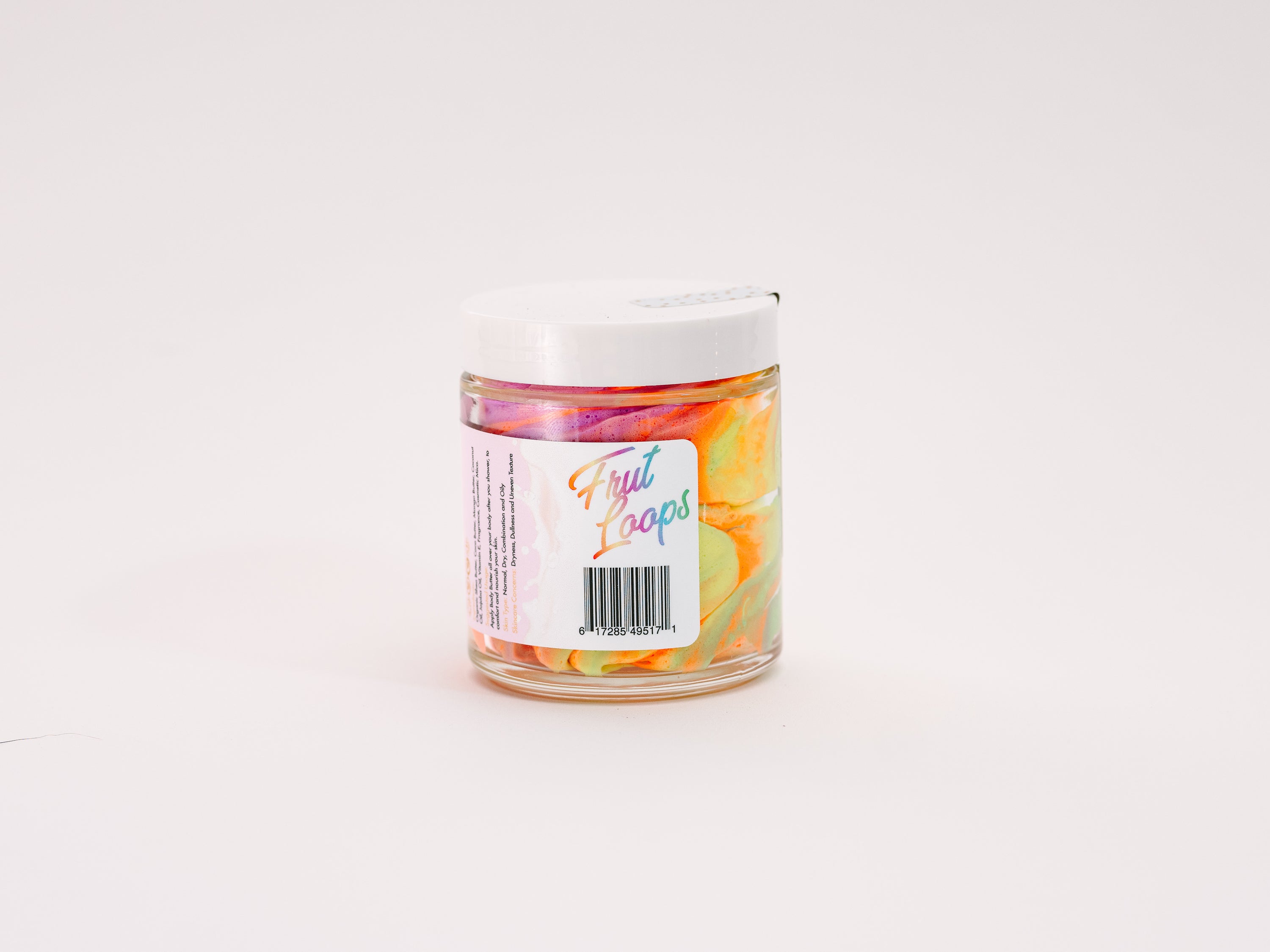 Frut Loops Whipped Body Butter in a jar, showcasing its creamy texture and vibrant colors reminiscent of Fruit Loops cereal.