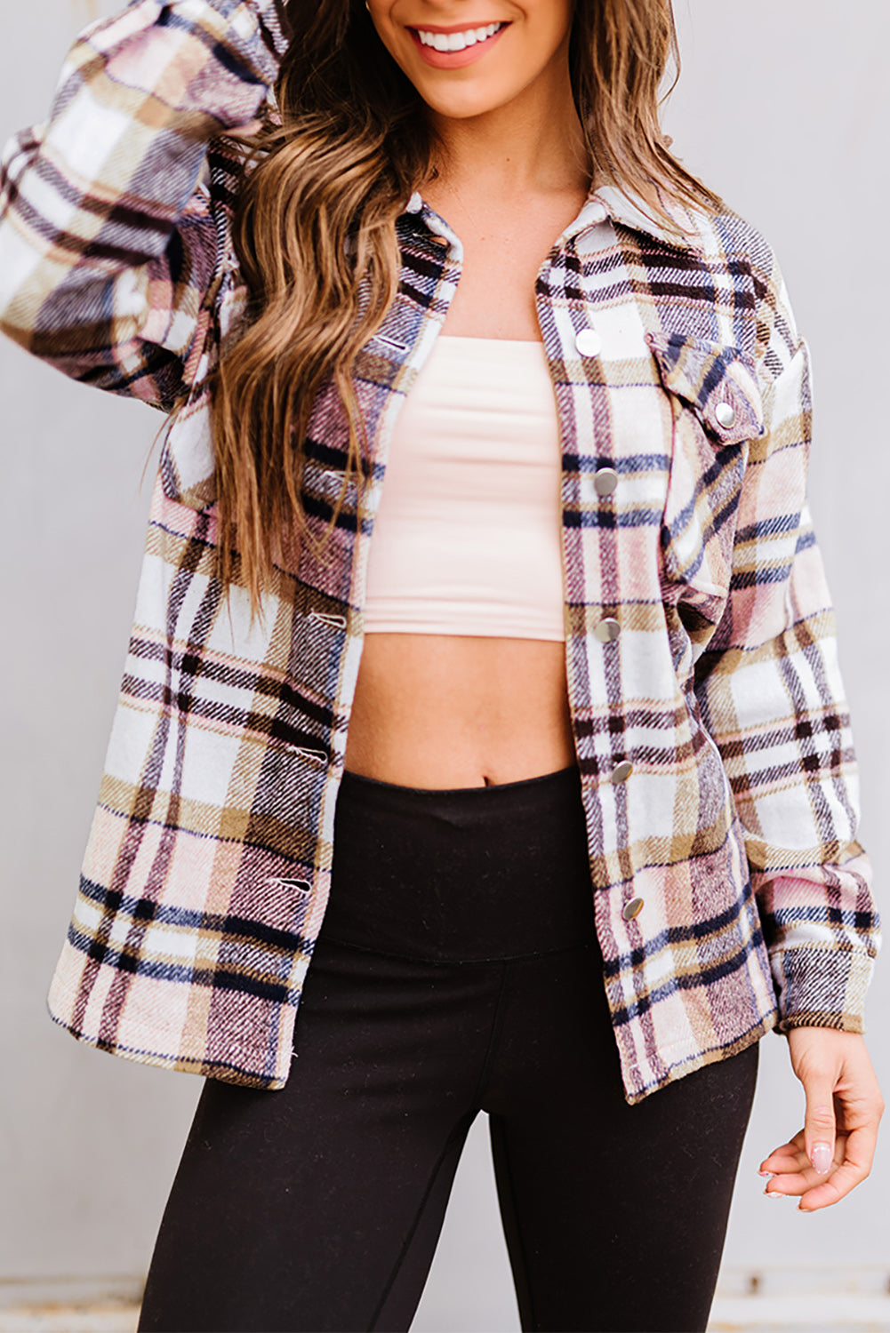 Geometric plaid print pocketed shacket featuring an oversized design, button front, and large front pockets, perfect for chilly weather.