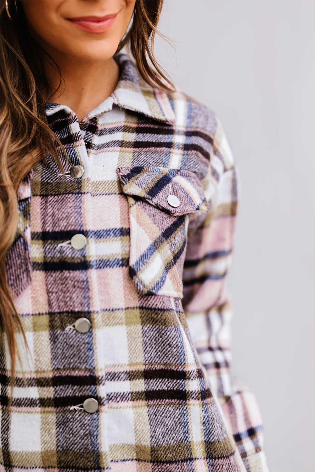 Geometric plaid print pocketed shacket featuring an oversized design, button front, and large front pockets, perfect for chilly weather.