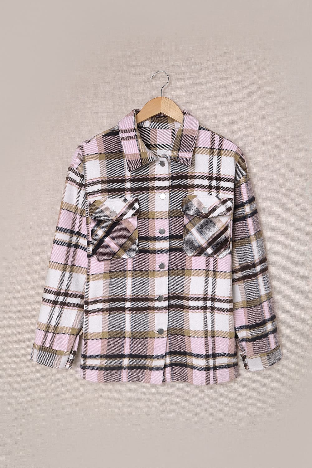 Geometric plaid print pocketed shacket featuring an oversized design, button front, and large front pockets, perfect for chilly weather.