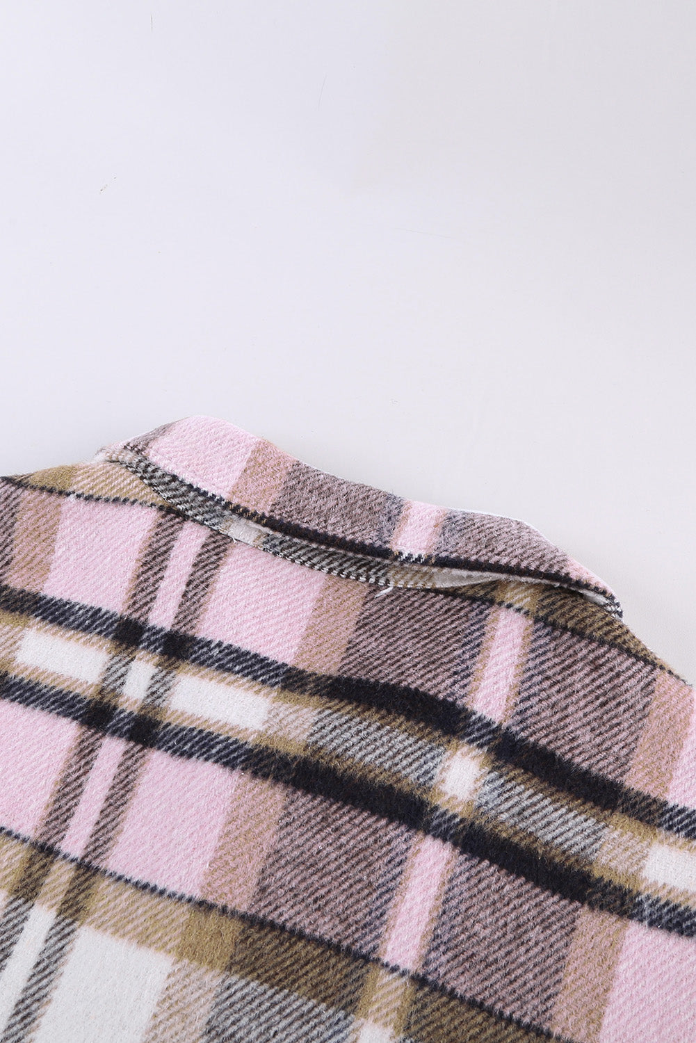 Geometric plaid print pocketed shacket featuring an oversized design, button front, and large front pockets, perfect for chilly weather.