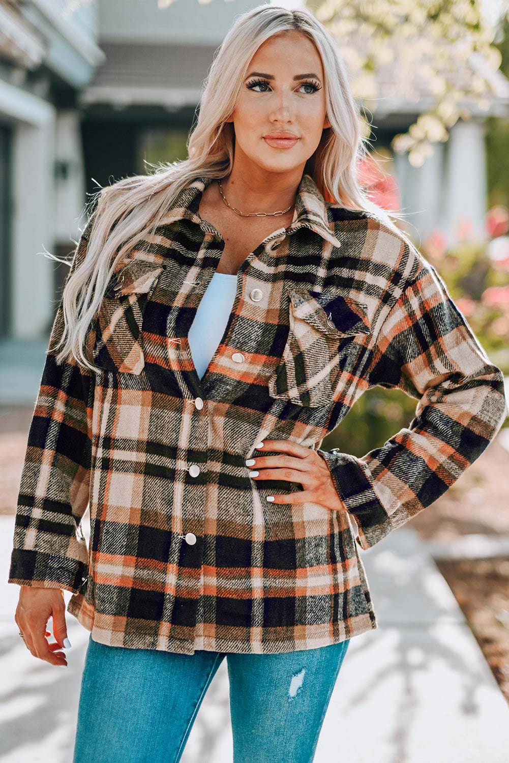 Geometric plaid print pocketed shacket featuring an oversized design, button front, and large front pockets, perfect for chilly weather.