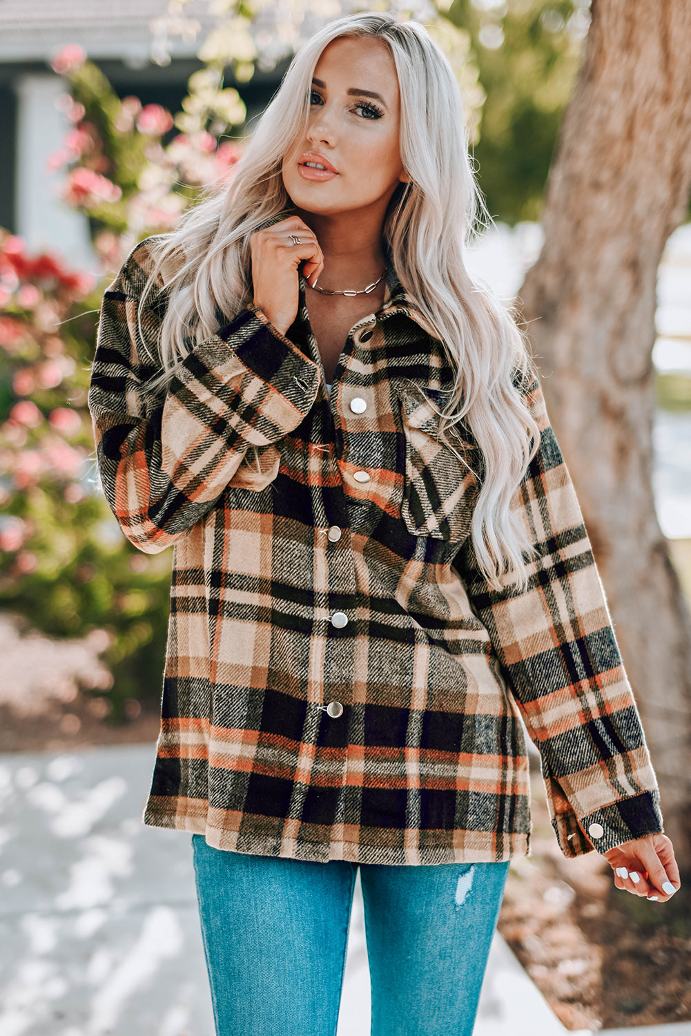 Geometric plaid print pocketed shacket featuring an oversized design, button front, and large front pockets, perfect for chilly weather.