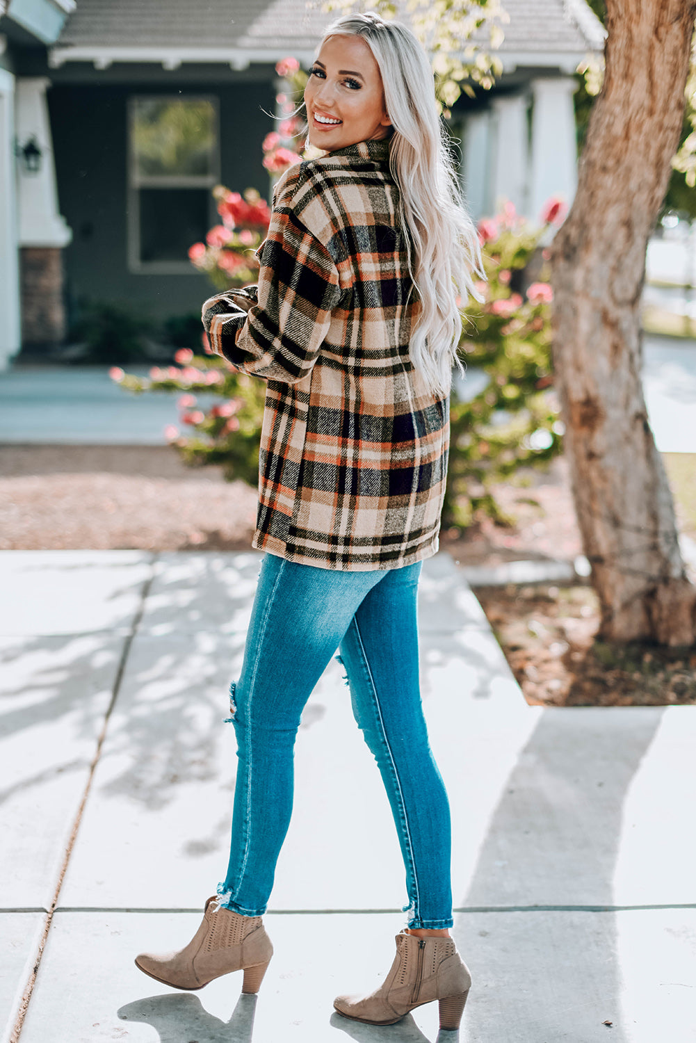 Geometric plaid print pocketed shacket featuring an oversized design, button front, and large front pockets, perfect for chilly weather.