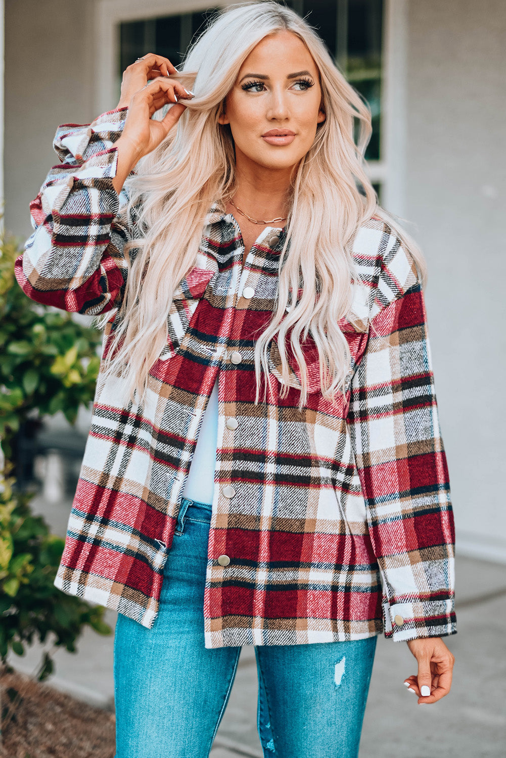 Geometric plaid print pocketed shacket featuring an oversized design, button front, and large front pockets, perfect for chilly weather.