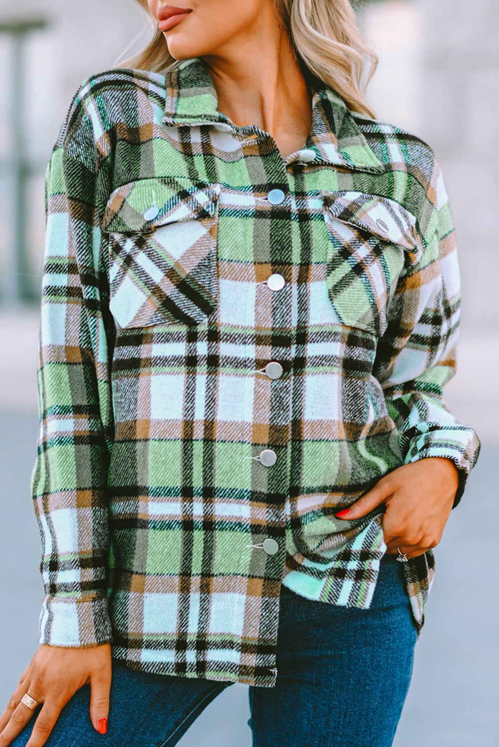 Geometric plaid print pocketed shacket featuring an oversized design, button front, and large front pockets, perfect for chilly weather.