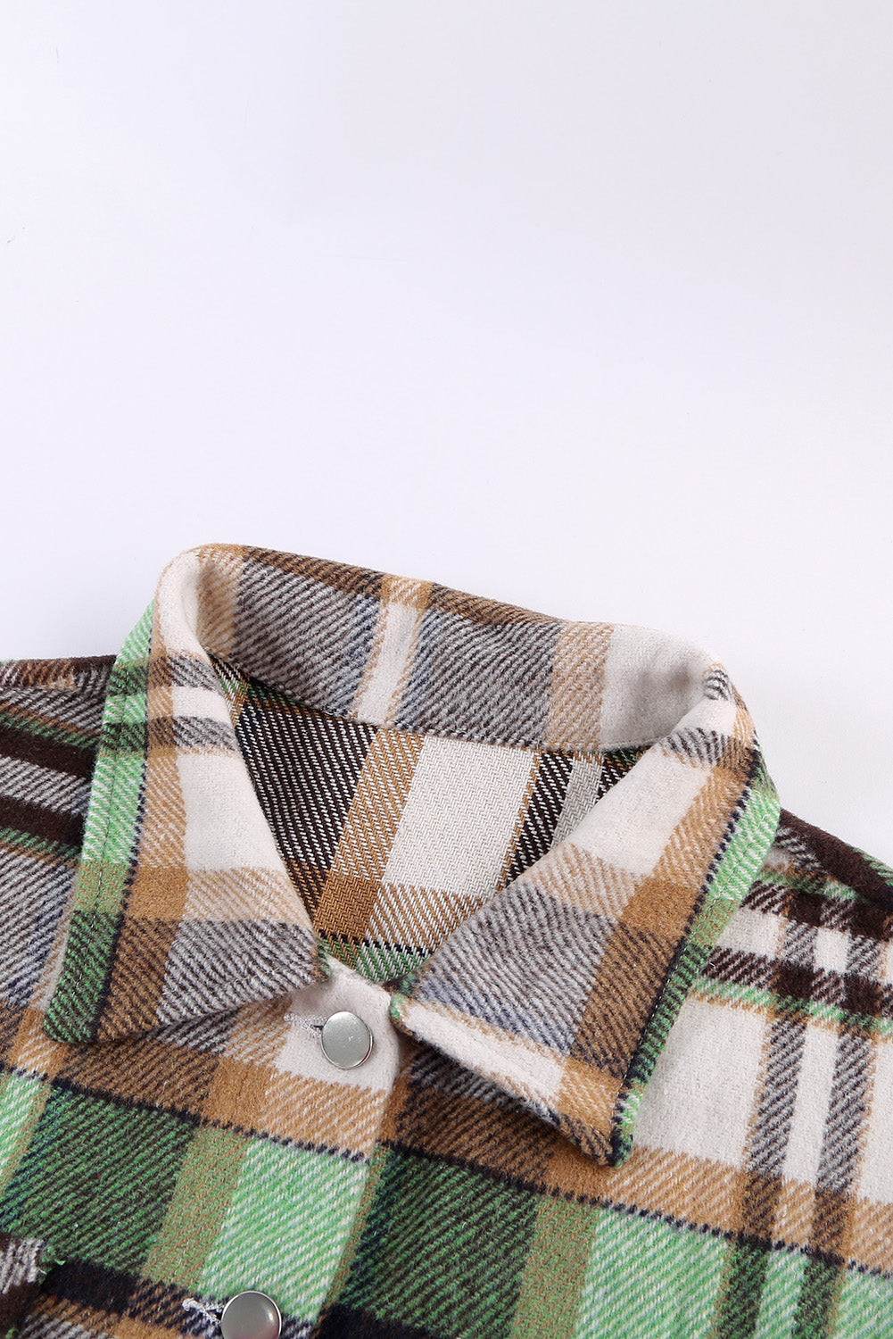 Geometric plaid print pocketed shacket featuring an oversized design, button front, and large front pockets, perfect for chilly weather.