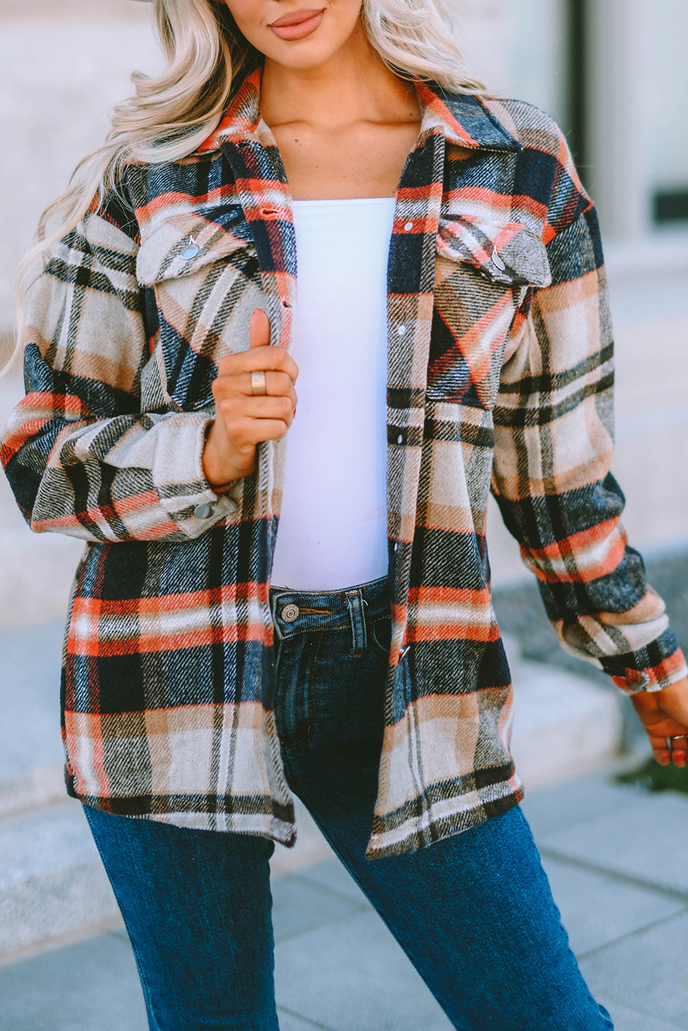 Geometric plaid print pocketed shacket featuring an oversized design, button front, and large front pockets, perfect for chilly weather.