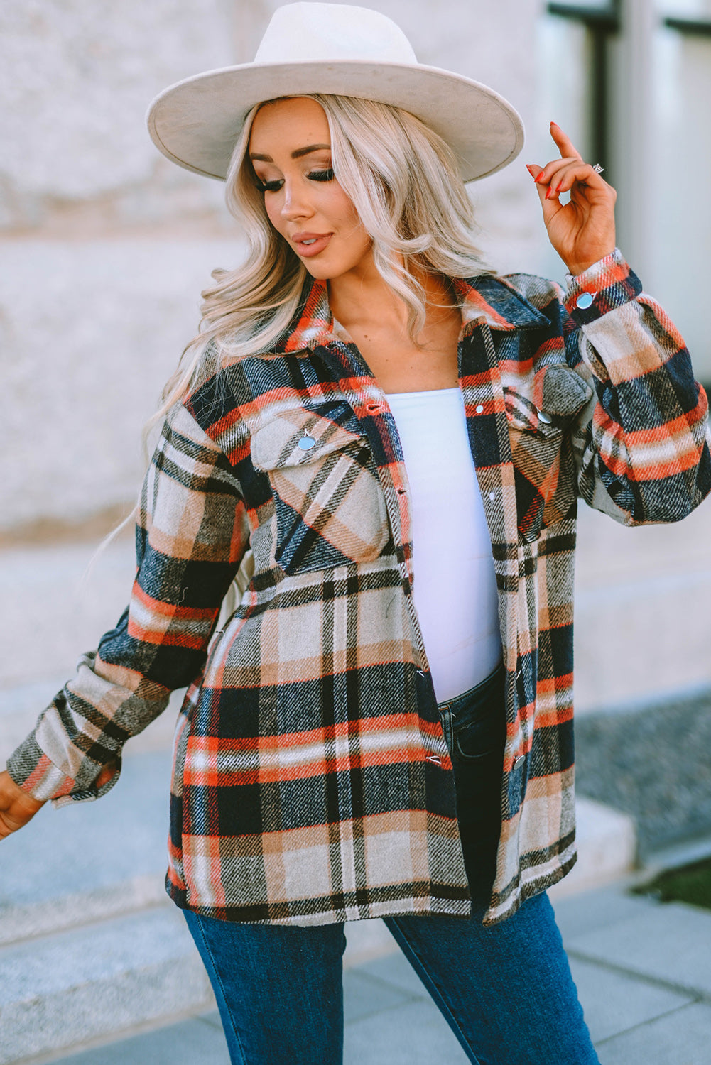 Geometric plaid print pocketed shacket featuring an oversized design, button front, and large front pockets, perfect for chilly weather.