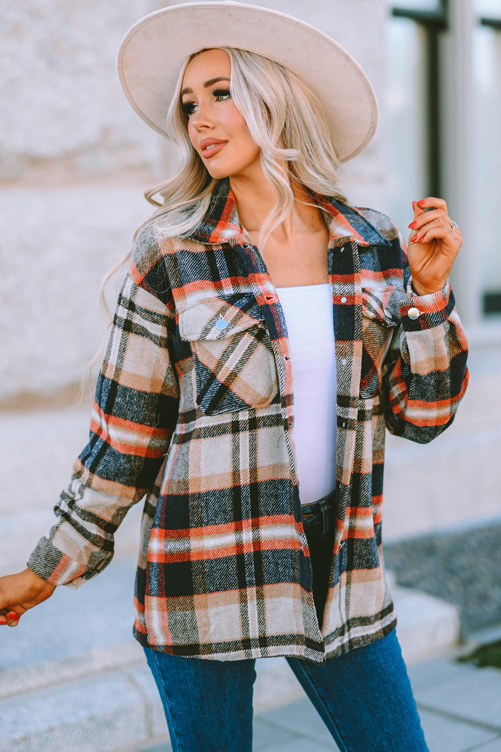 Geometric plaid print pocketed shacket featuring an oversized design, button front, and large front pockets, perfect for chilly weather.