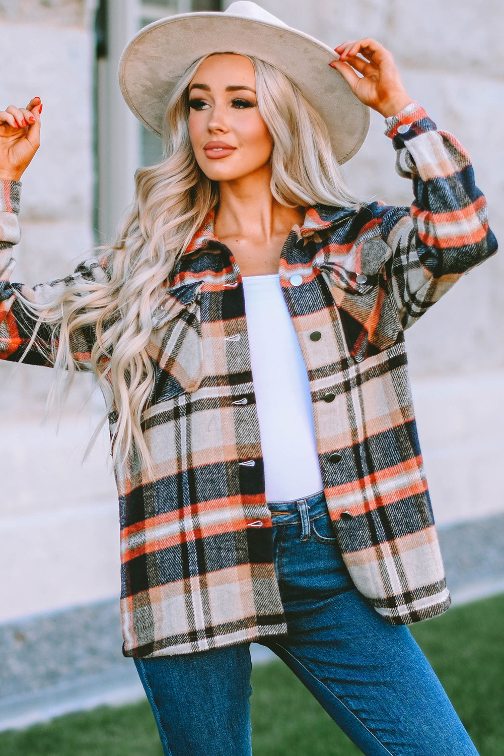 Geometric plaid print pocketed shacket featuring an oversized design, button front, and large front pockets, perfect for chilly weather.