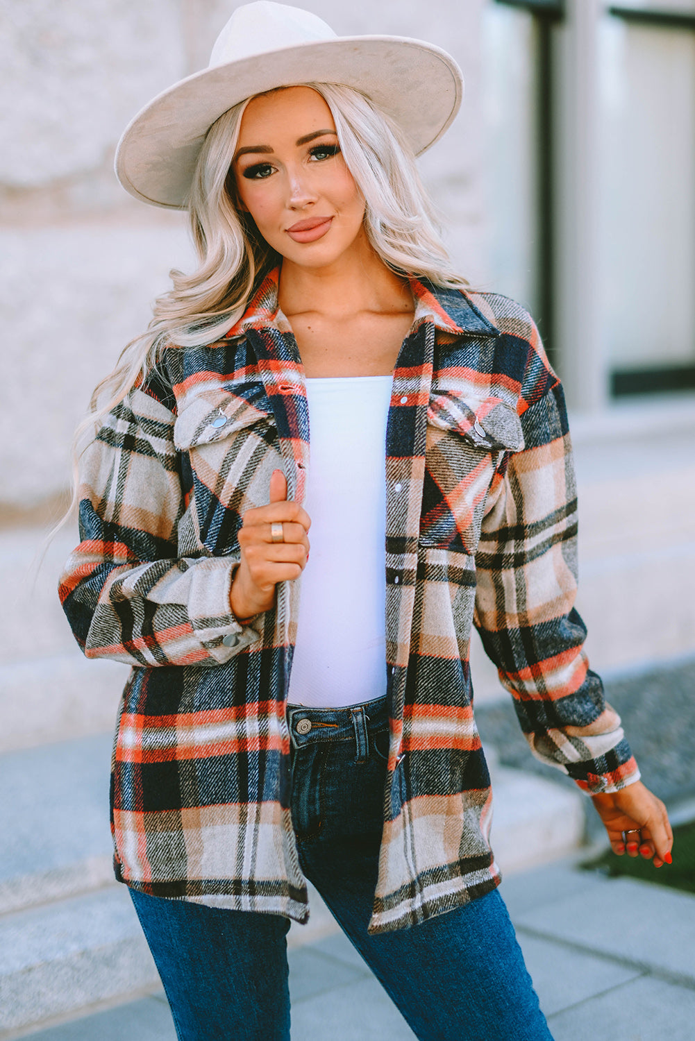 Geometric plaid print pocketed shacket featuring an oversized design, button front, and large front pockets, perfect for chilly weather.