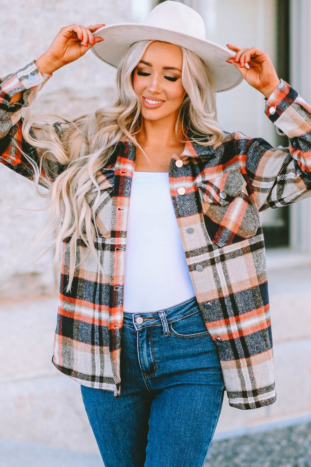 Geometric plaid print pocketed shacket featuring an oversized design, button front, and large front pockets, perfect for chilly weather.