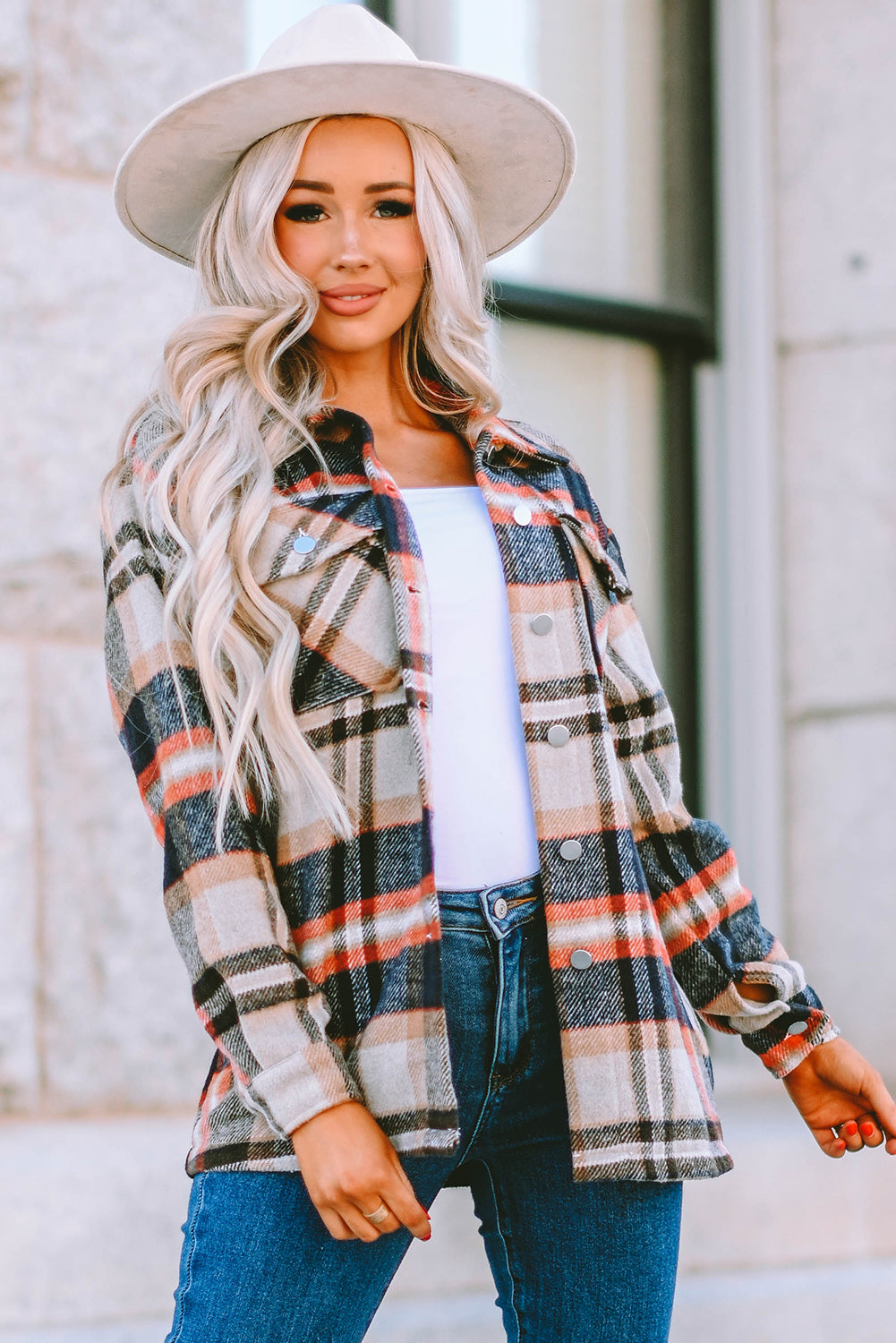 Geometric plaid print pocketed shacket featuring an oversized design, button front, and large front pockets, perfect for chilly weather.