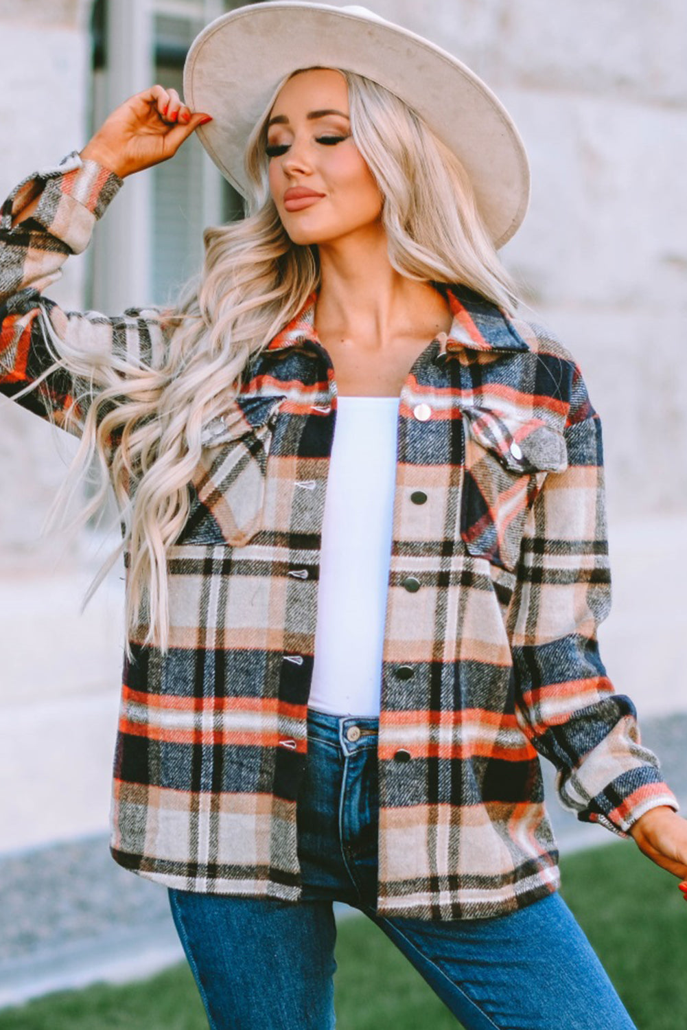 Geometric plaid print pocketed shacket featuring an oversized design, button front, and large front pockets, perfect for chilly weather.