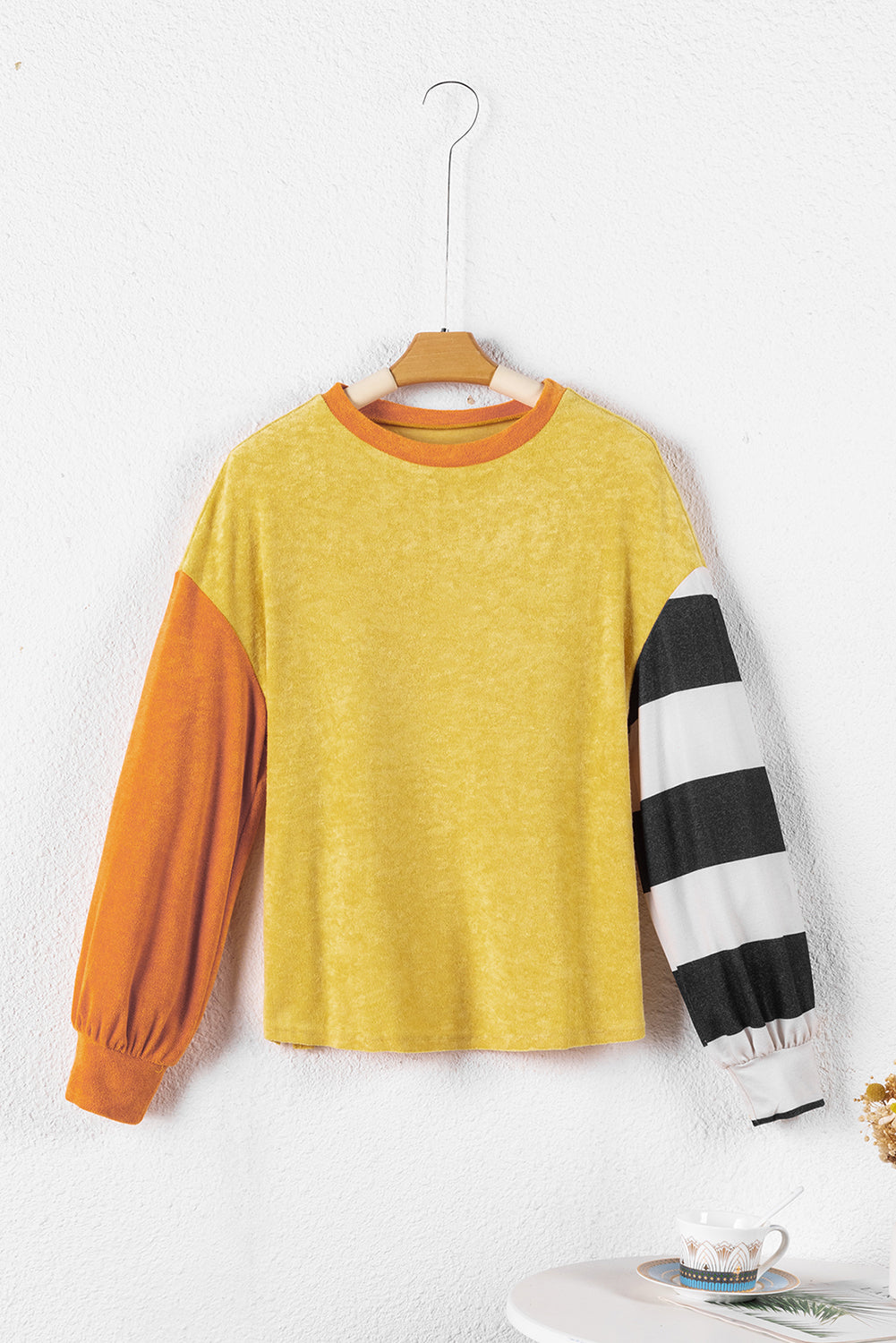 Ginger Colorblock Striped Sleeve Patchwork Drop Shoulder Top featuring a loose fit, colorblock design, and striped long sleeves.