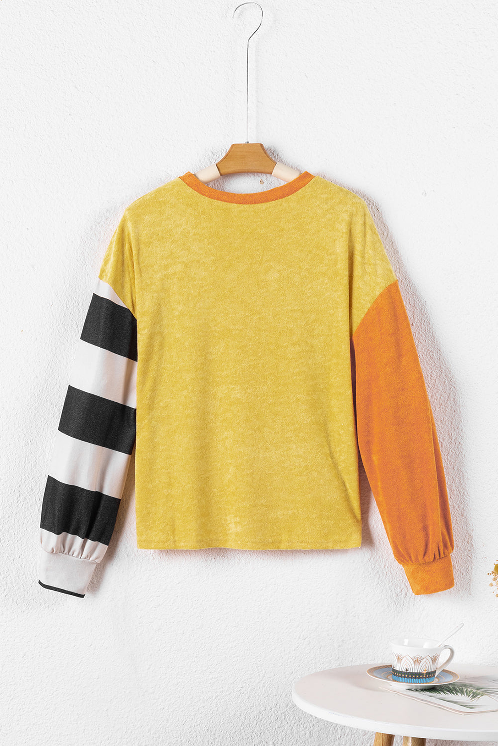 Ginger Colorblock Striped Sleeve Patchwork Drop Shoulder Top featuring a loose fit, colorblock design, and striped long sleeves.