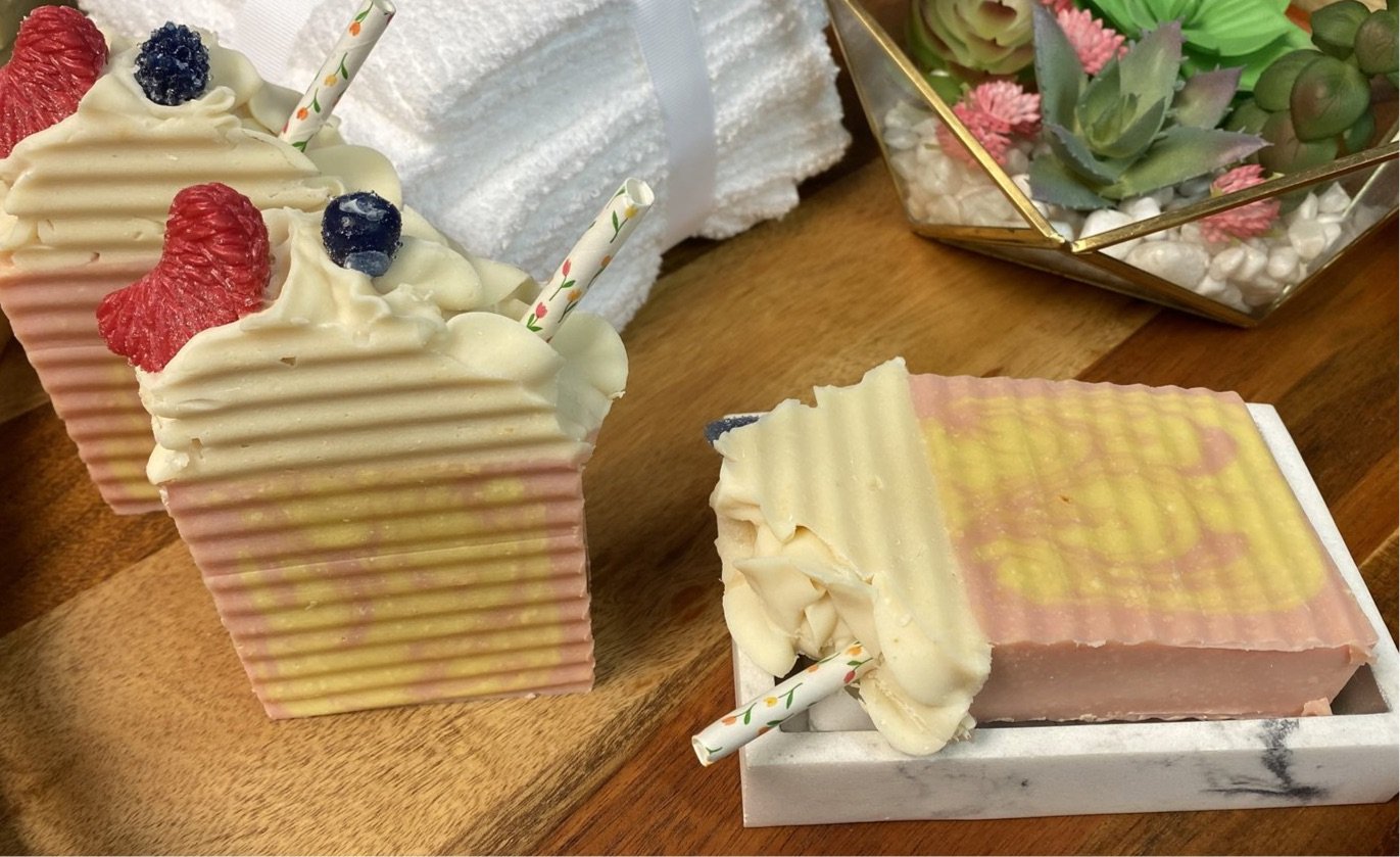 Goats Milk Raspberry Lemonade soap bar with vibrant colors and luxurious bubbles, perfect for sensitive skin.